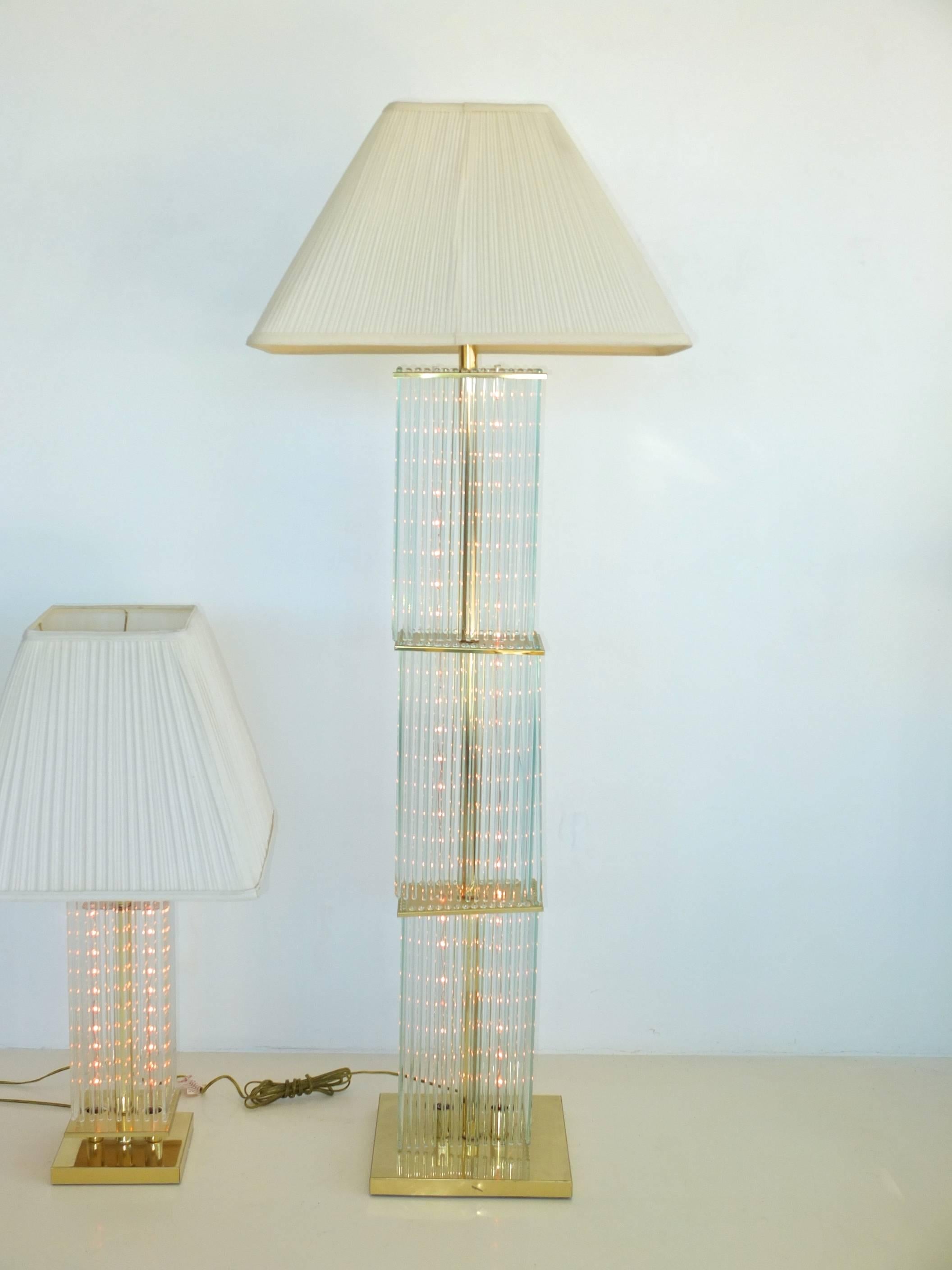 Dazzling floor lamp by Gaetano Sciolari for Lightolier in brass with multiple glass rods. 

Illumination comes both from a single socket above for standard size Edison screw cap bulb up to 150 watts as well as double vertical perspex tubes with