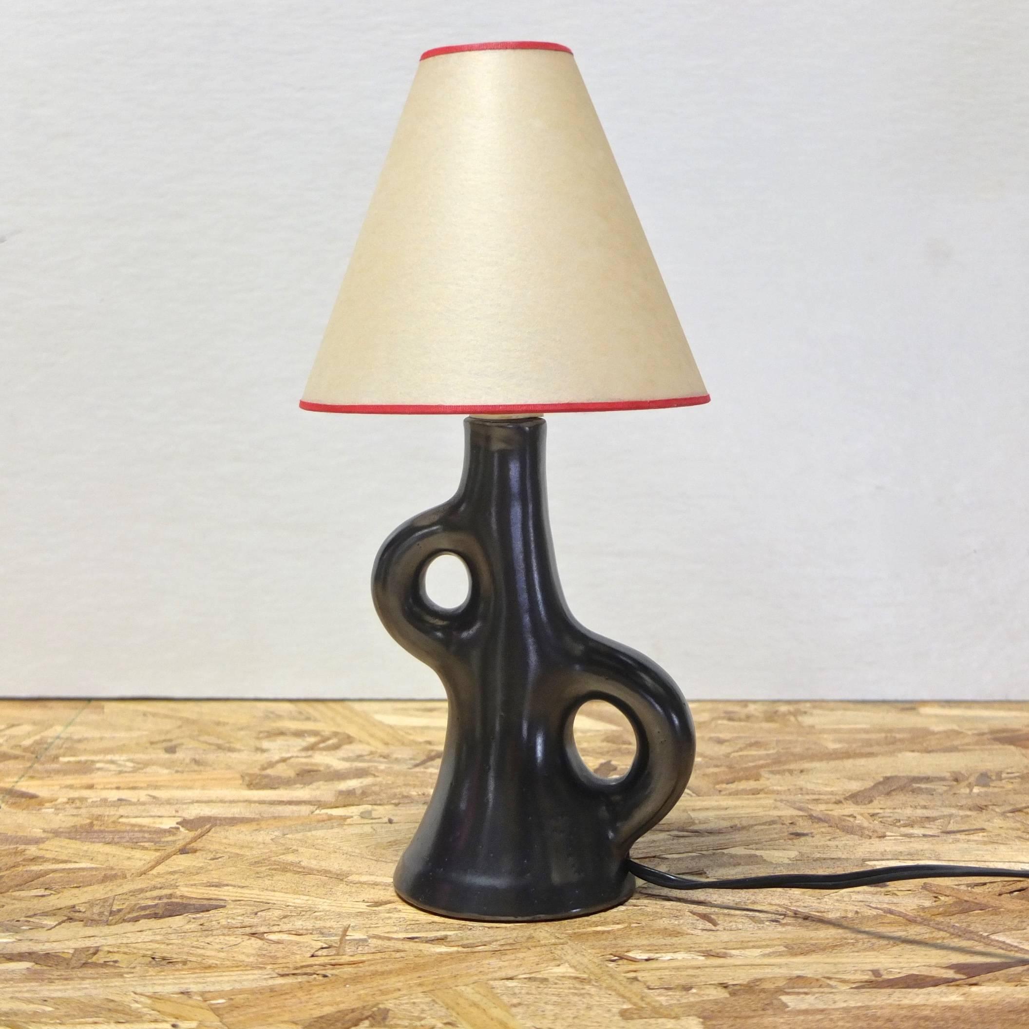 Vintage French black ceramic lamp in the organic biomorphic style of French ceramicist, Georges Jouve.

Rewired. 

Choice of E12 candelabra socket or B22 bayonnette socket.

Measures 9 inches to top of socket. 12 inches high as shown.


