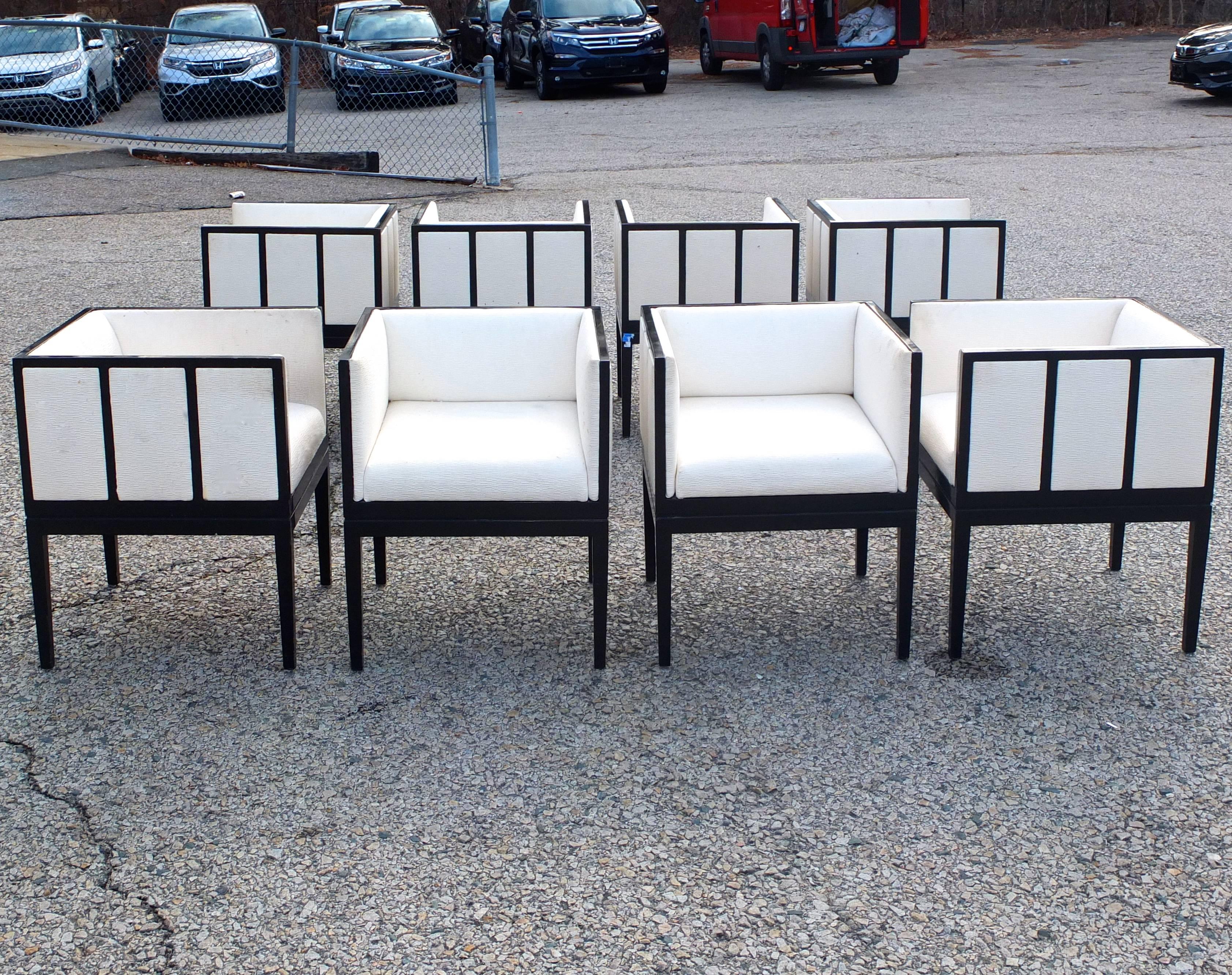 Set of eight dining armchairs custom designed by Juan Montoya in 1990 for a private residence in Georgetown DC. Fabricated and upholstered by Ken Flam in white textured fabric by Clarence House. Cube form black lacquered wood frame chairs with inset