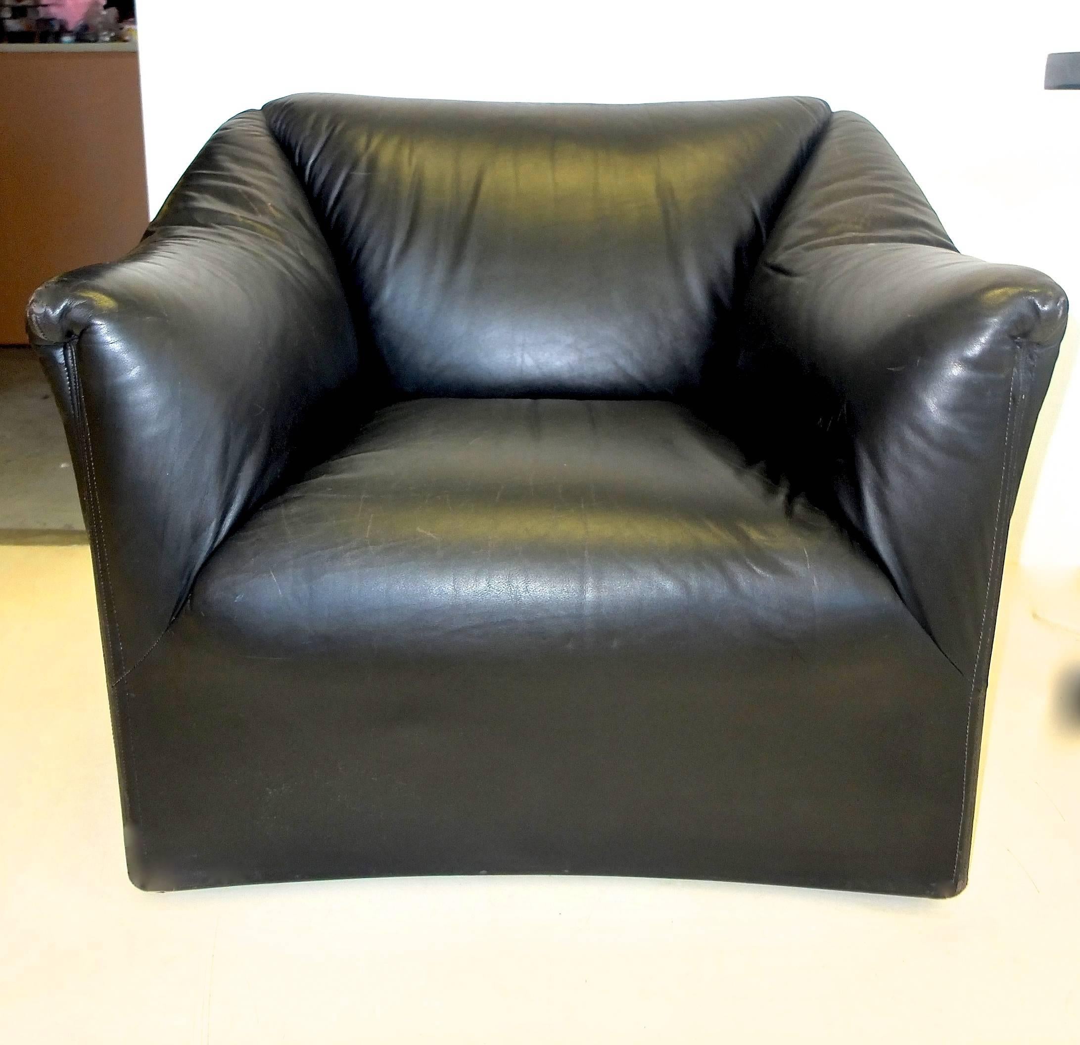 Black leather armchair custom designed by Juan Montoya in 1990 for a published residential interiors project in Georgetown, DC and fabricated by Ken Flam in Dualoy leather, deep proportions, supple leather over a rounded back, gently flared arms and
