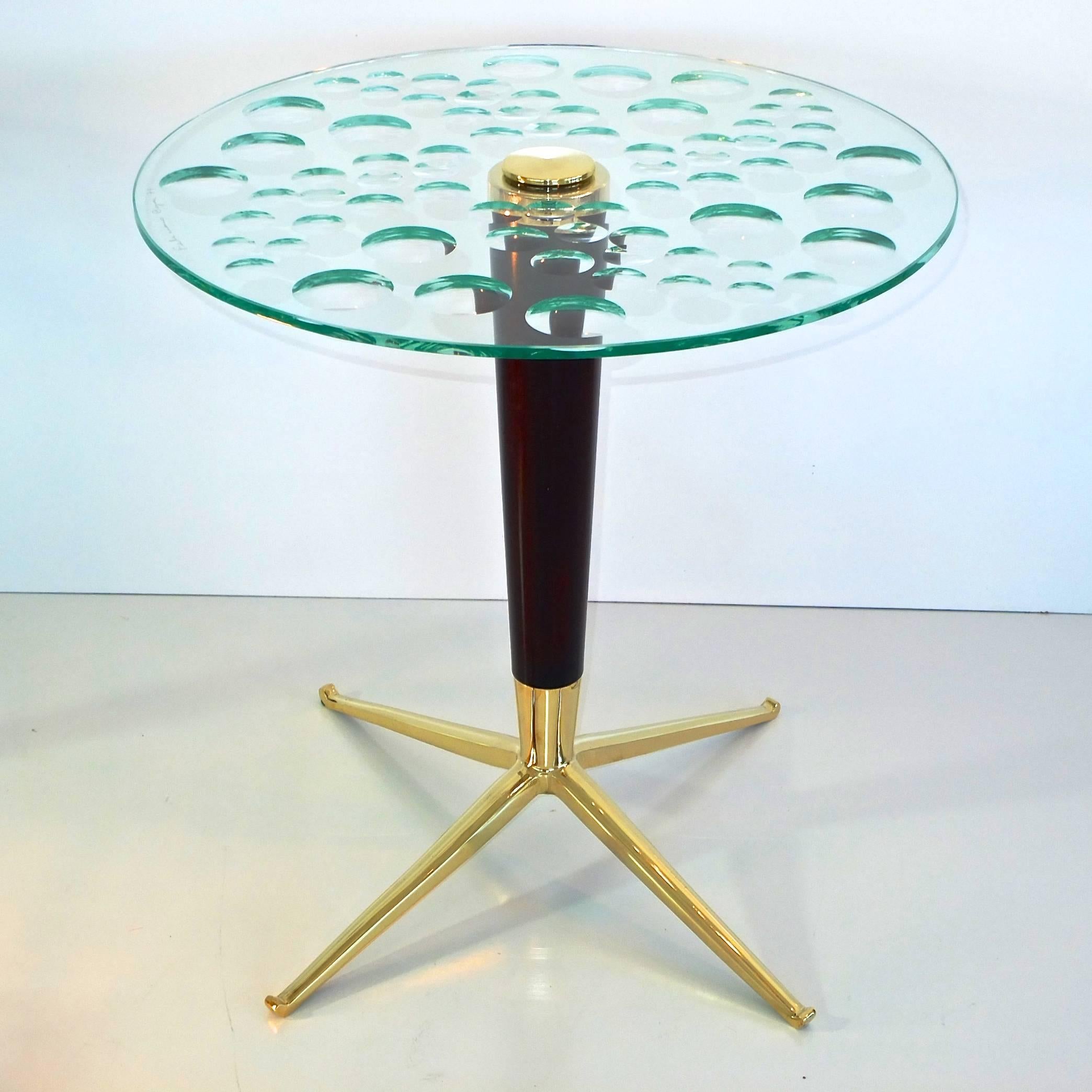 BG Galleries is delighted to introduce our exclusive limited edition occasional or side table custom crafted by our own artisans combining a 1950's Italian solid brass four star table base by Melchiorre Bega (1898-1976) for an ebonized solid