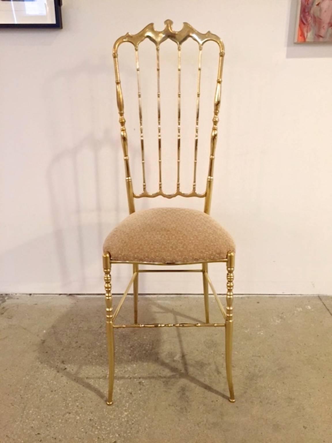 Solid brass Chiavari chair with the desirable highback.

This is the gold standard (pun intended) in chic! Solid polished brass Chiavari chair with daintily splayed feet. 

First designed by Giuseppe Gaetano Descalzi and continuously produced