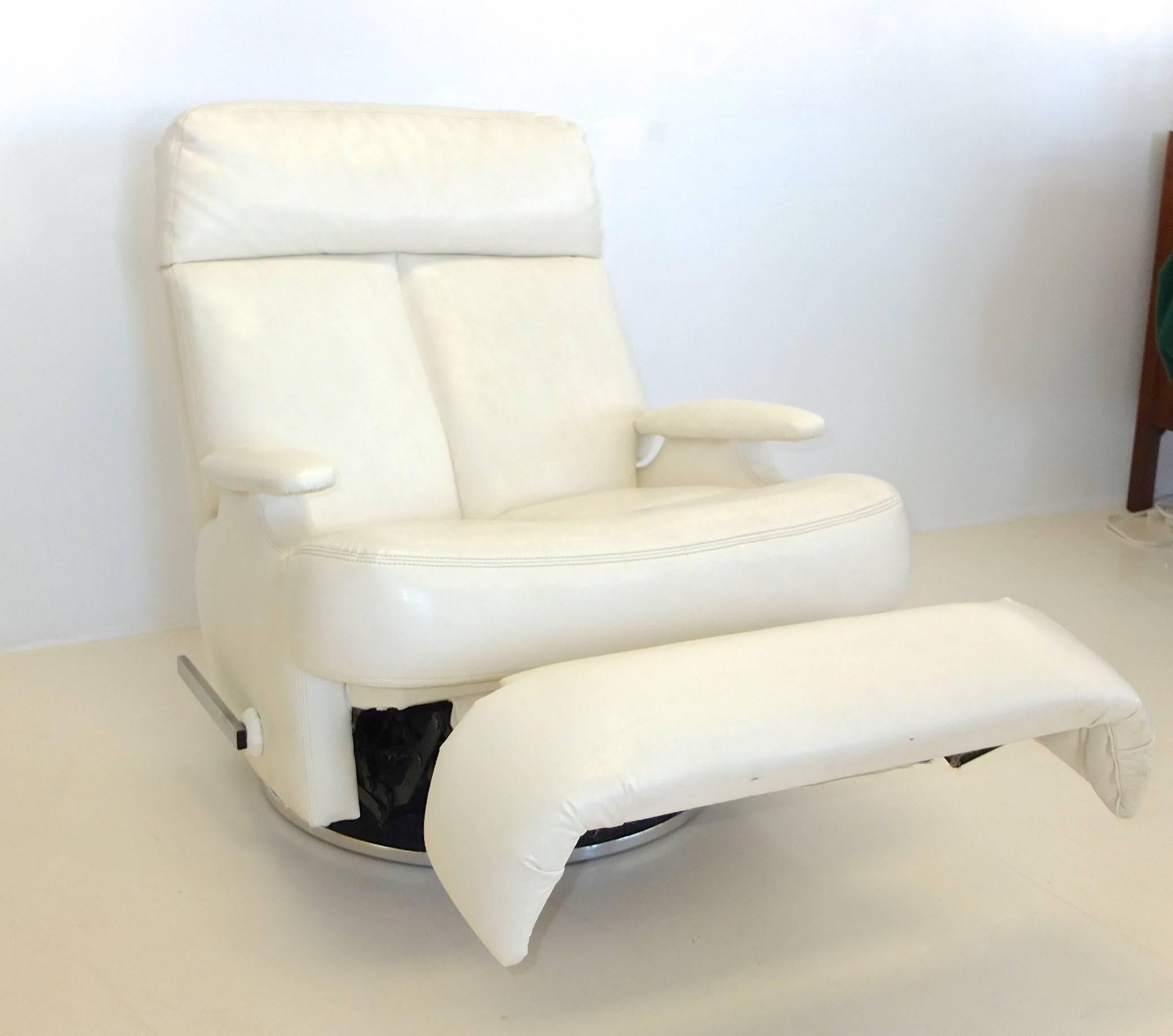 Upgrade to First Class at home (or at sea) with this pair of white kid glove faux-leather reclining swivel lounge chairs on round chrome pedestal bases by The Barcalounger Company of Buffalo, NY.

Since these have such a stable and low center of