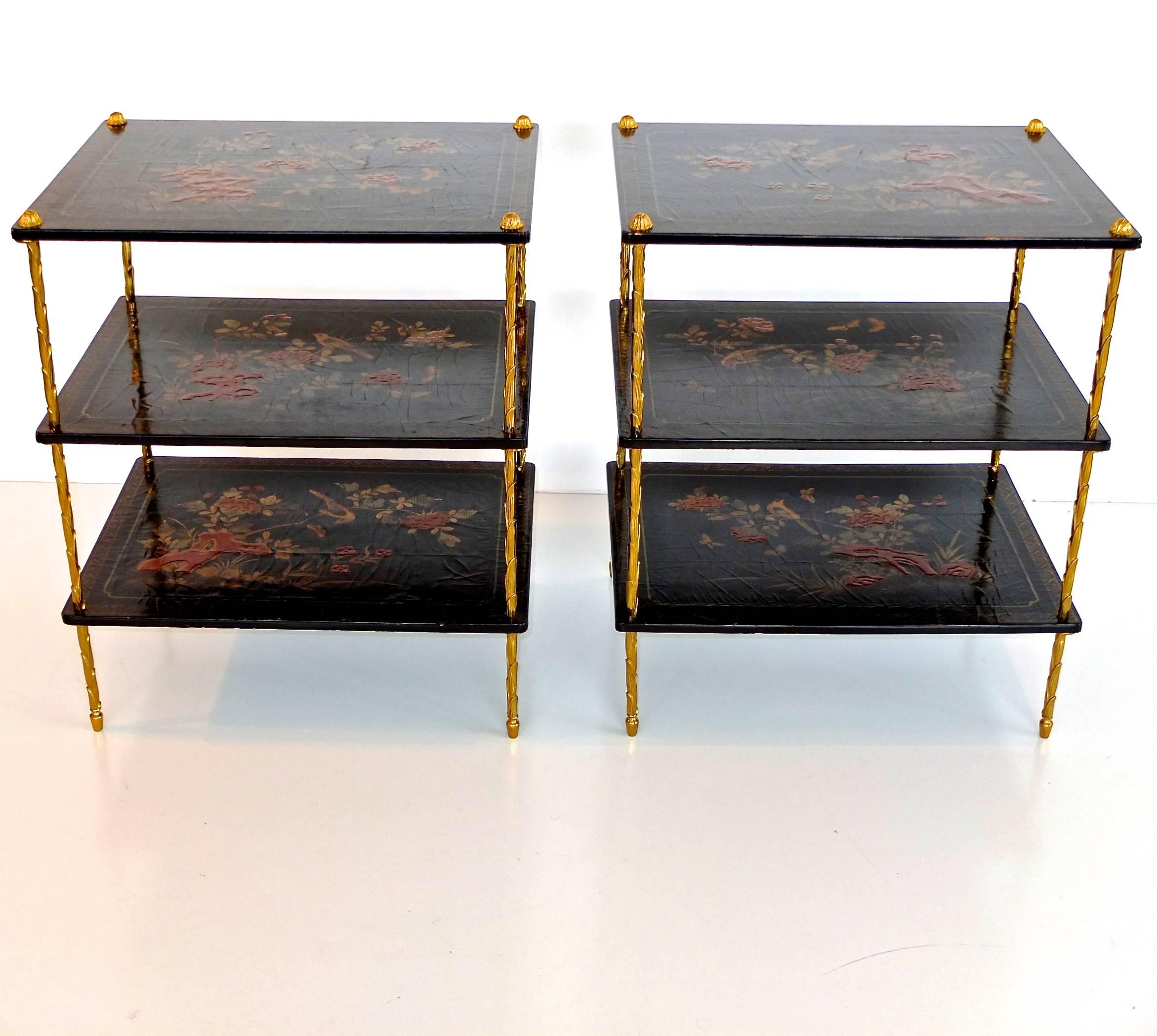 Pair of Maison Jansen three-tier etageres or side tables with signature Maison Jansen gilt metal palm trunk form supports and legs and three black japanned lacquered wood tiers.

Perfect size for nightstands or side tables.

Very good original