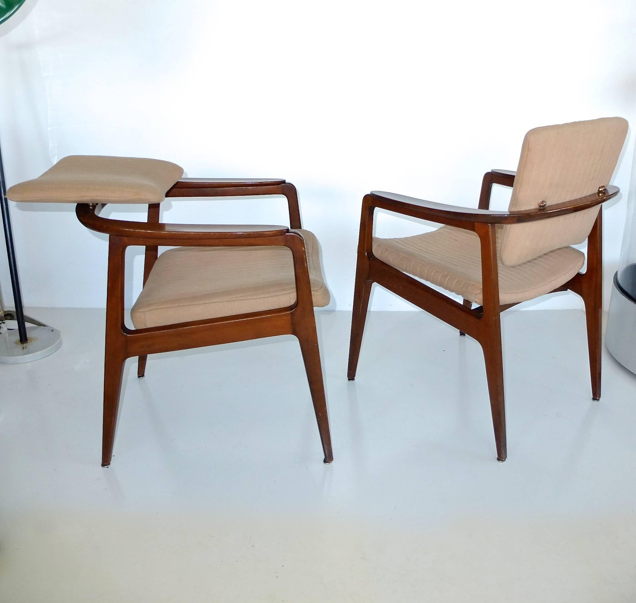 Pair of model 132 tilt-back armchairs designed in 1954 by Sigvard Bernadotte for France and Son and imported to the USA by John Stuart.

The chair is made from the finest teakwood and protected by a clear gloss varnish.

The ergonomic back