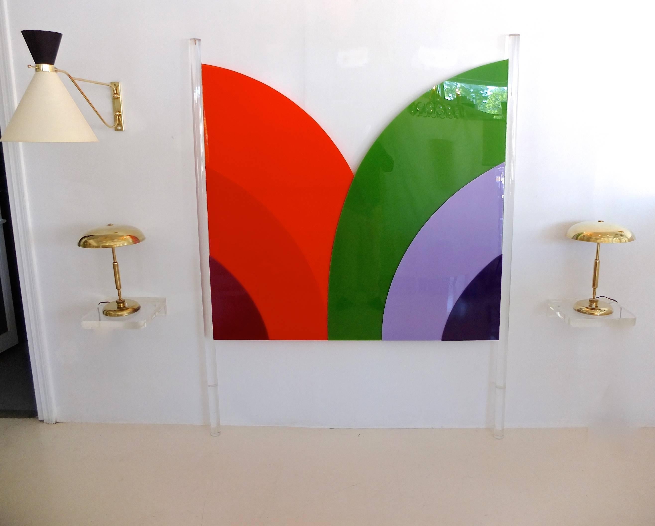 Fun pop art constructivist two-poster Lucite headboard with overlapping colored acrylic rainbow bands in the spirit of Frank Stella's protractor series from the 1960s.

Colors: Maroon, red, orange, green, light purple and dark purple.

Headboard