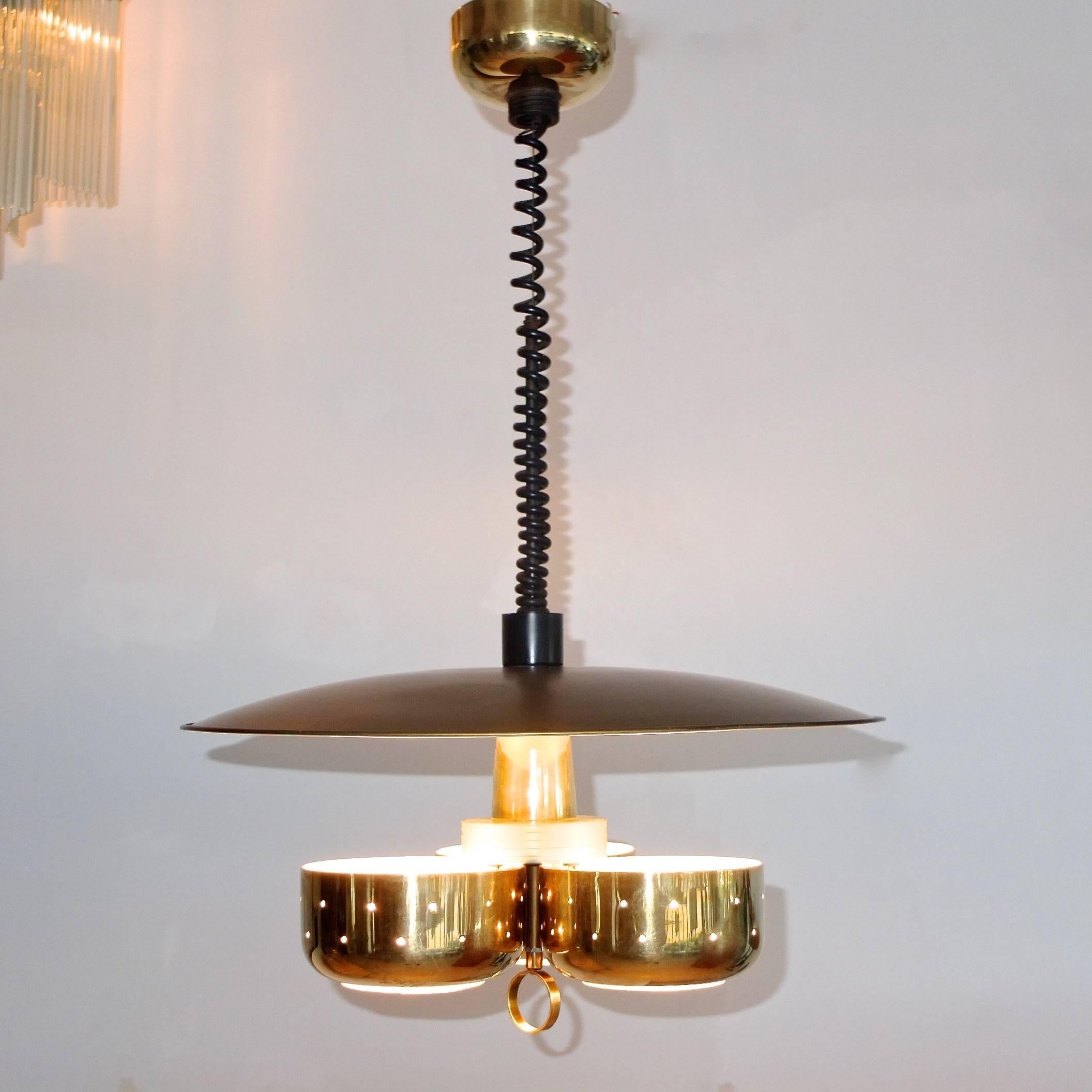 SATURDAY SALE Boston Design Center

Original Lightolier pendant, circa 1958 designed by Gerald Thurston who was clearly influenced by Gino Sarfatti and Gaetano Sciolari.
This pendant provides both down and diffused uplighting by Virtue of the three