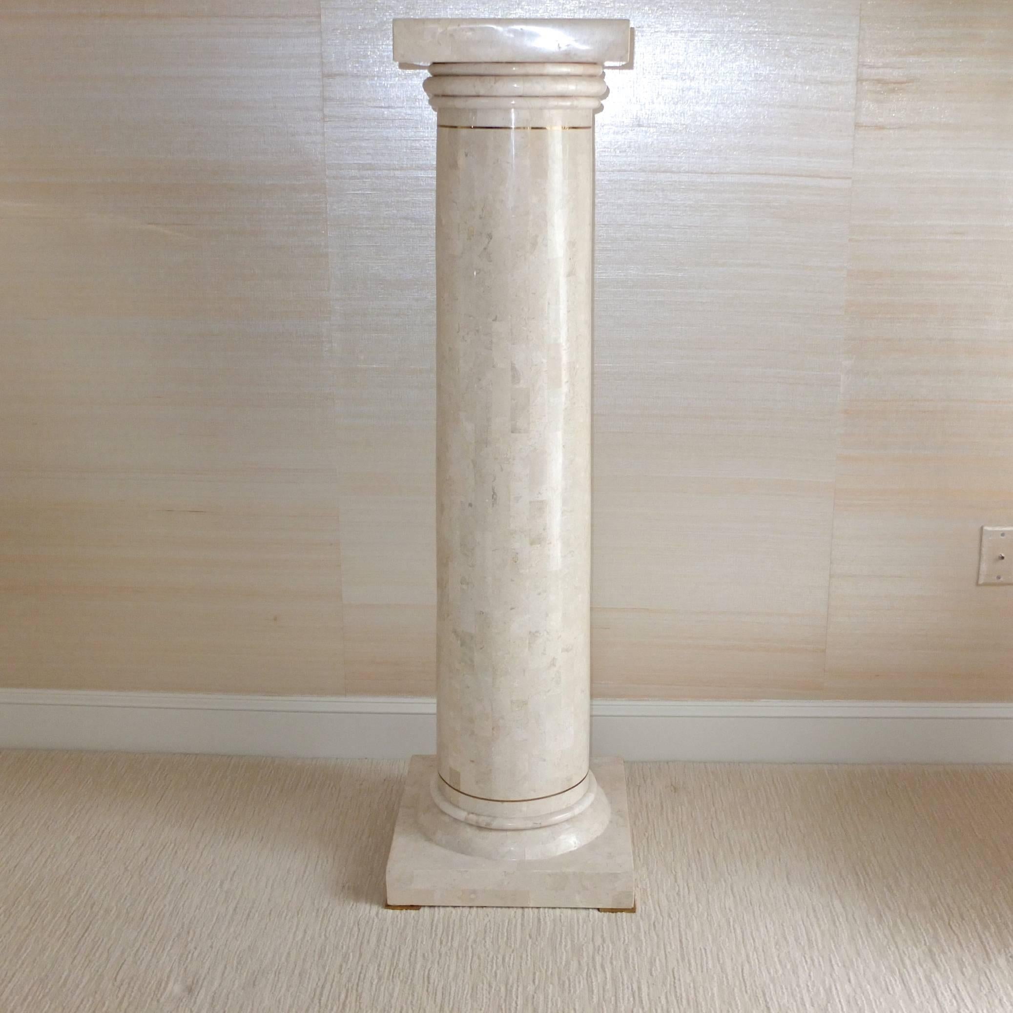 Maitland Smith Doric column with square plinth and base made of tessellated fossil stone with brass inlay and feet. Excellent condition.

Top is 12-3/4 inches square.

Solid heavy construction. Can definitely support something with