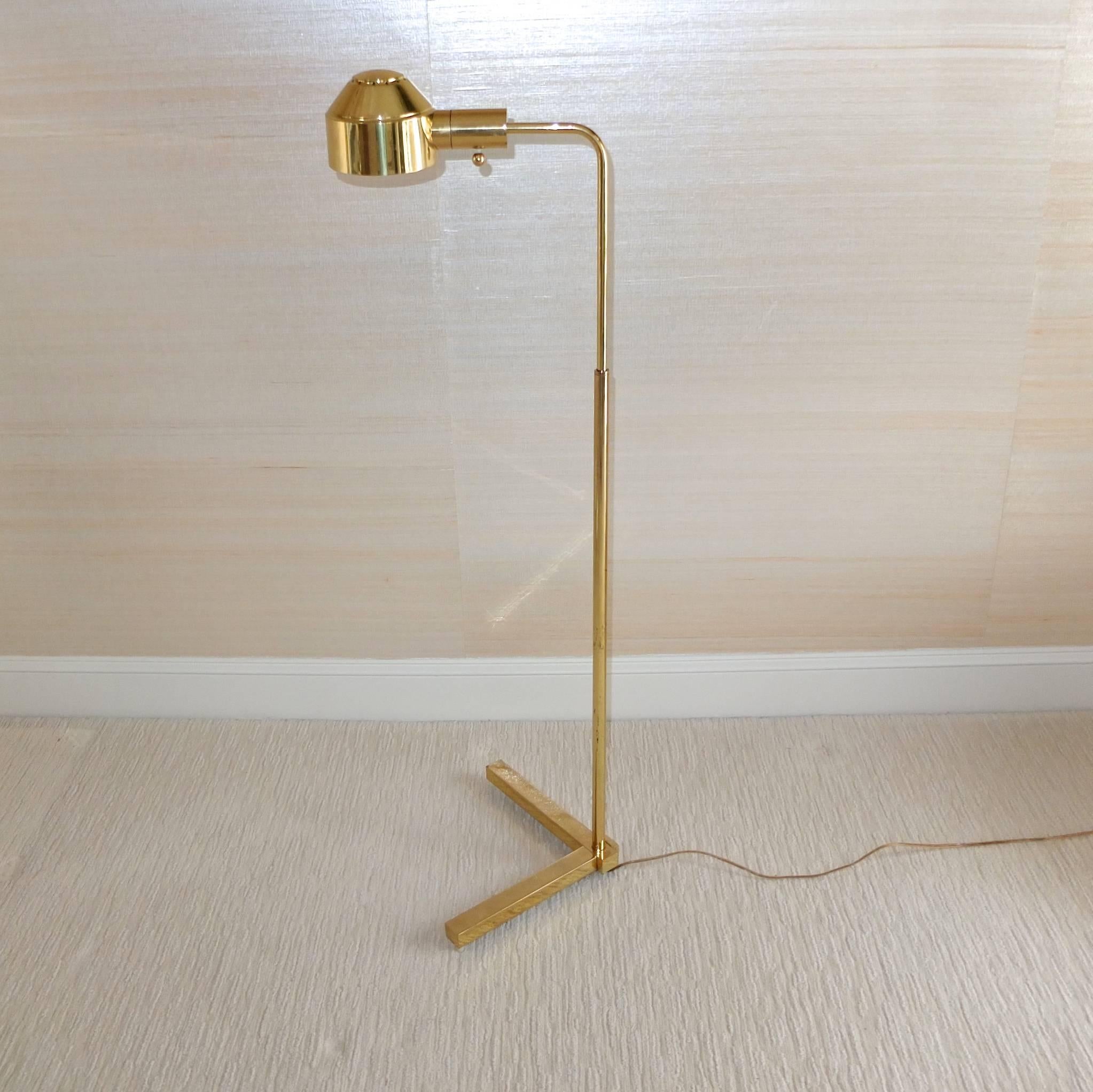 Vintage 1970s E. F. Chapman brass floor lamp. Pharmacy style with telescoping tubular stem on heavy solid brass V-Form base with rotating brass shade.

This lamp was produced back when Chapman's factory was in Avon, MA so the quality is of a much