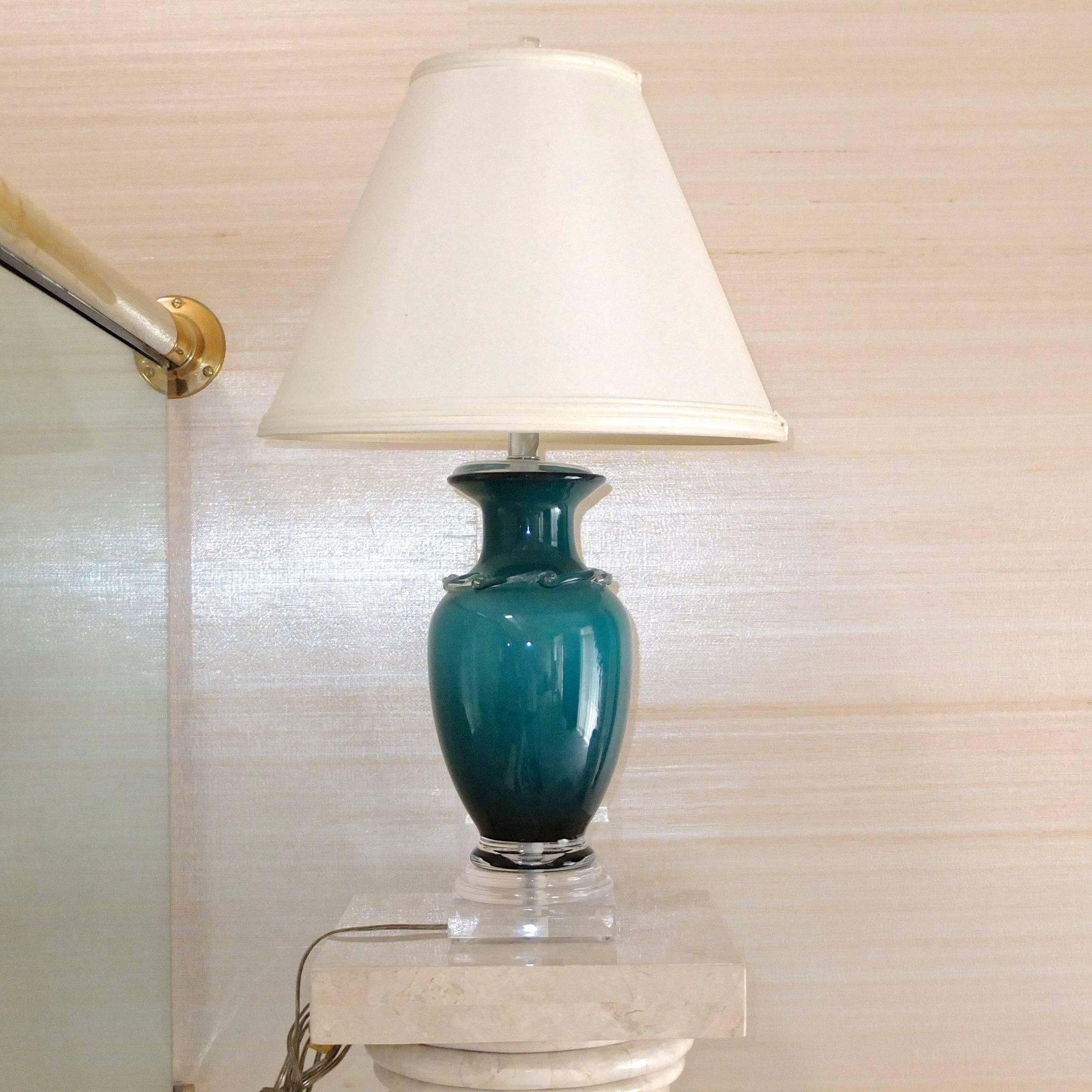 Frederick Cooper (signed) vase form table lamp in tonal colored glass (turquoise / teal) on clear glass base with original shade.


Although this is a single lamp, at the moment we happen to have a matching art glass vase which we can convert