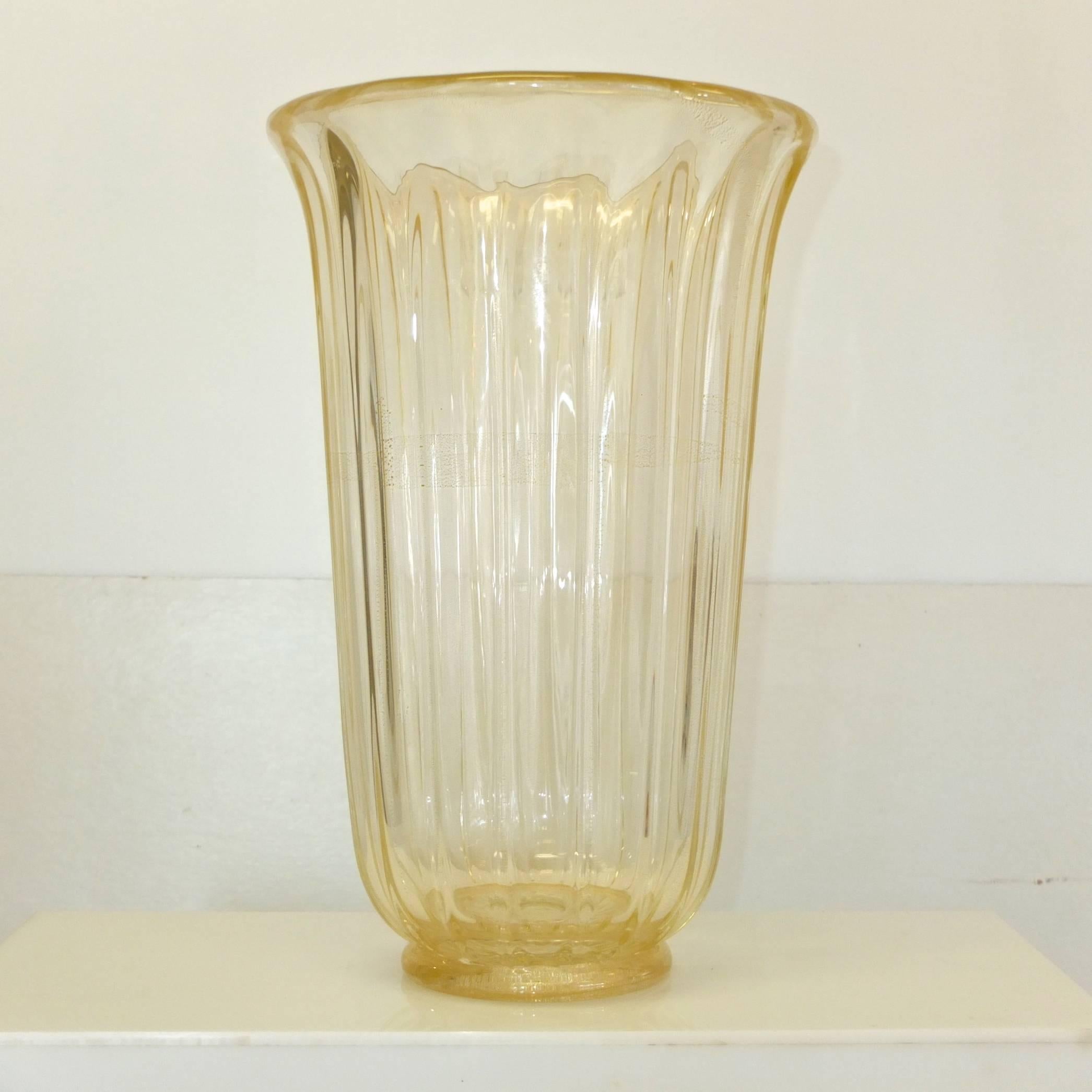 Large-scale Murano glass flower vase embedded with pure gold flecks and controlled bubbles. Signed Seguso V. D'Arte. Fluted bell form. 18 inches tall, 12 inches diameter. Excellent condition.