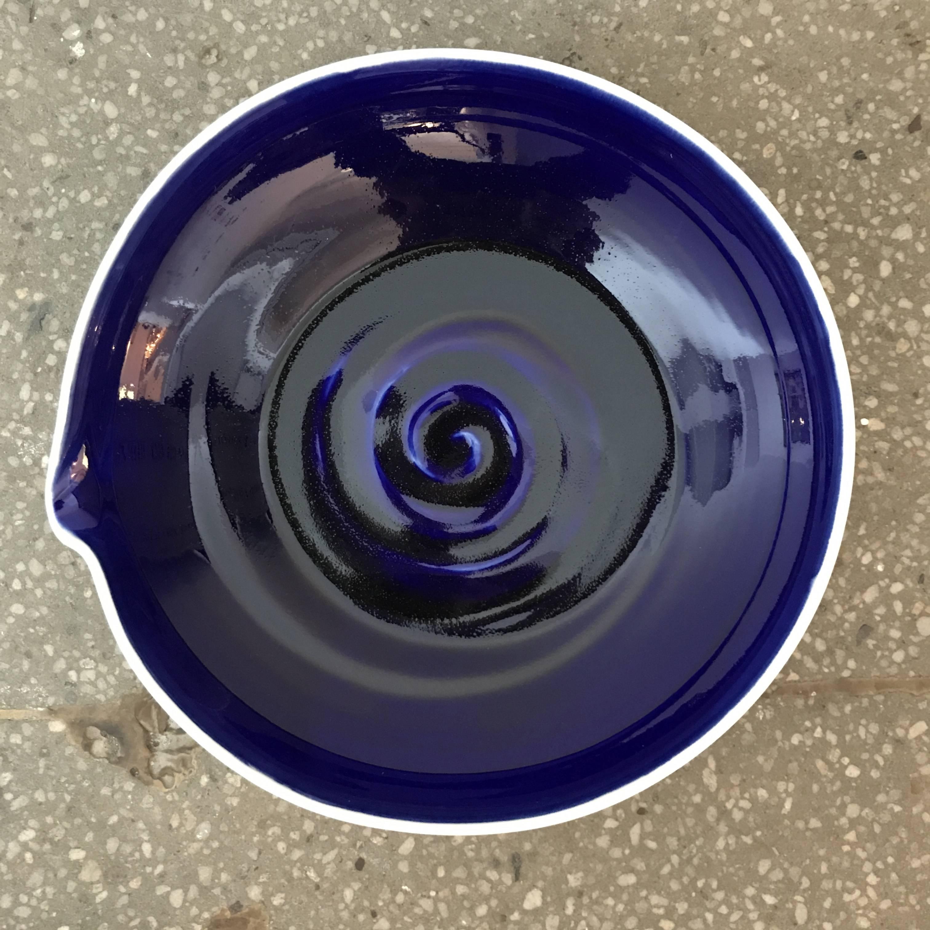Hand-thrown blue and white ceramic Studio Pottery bowls created by a local artisan in Jaffa Israel. 
Indigo blue interior with white exterior. Subtle bend detail on the rim of each bowl. Intricate graphics and artist signature on the bottom. 13