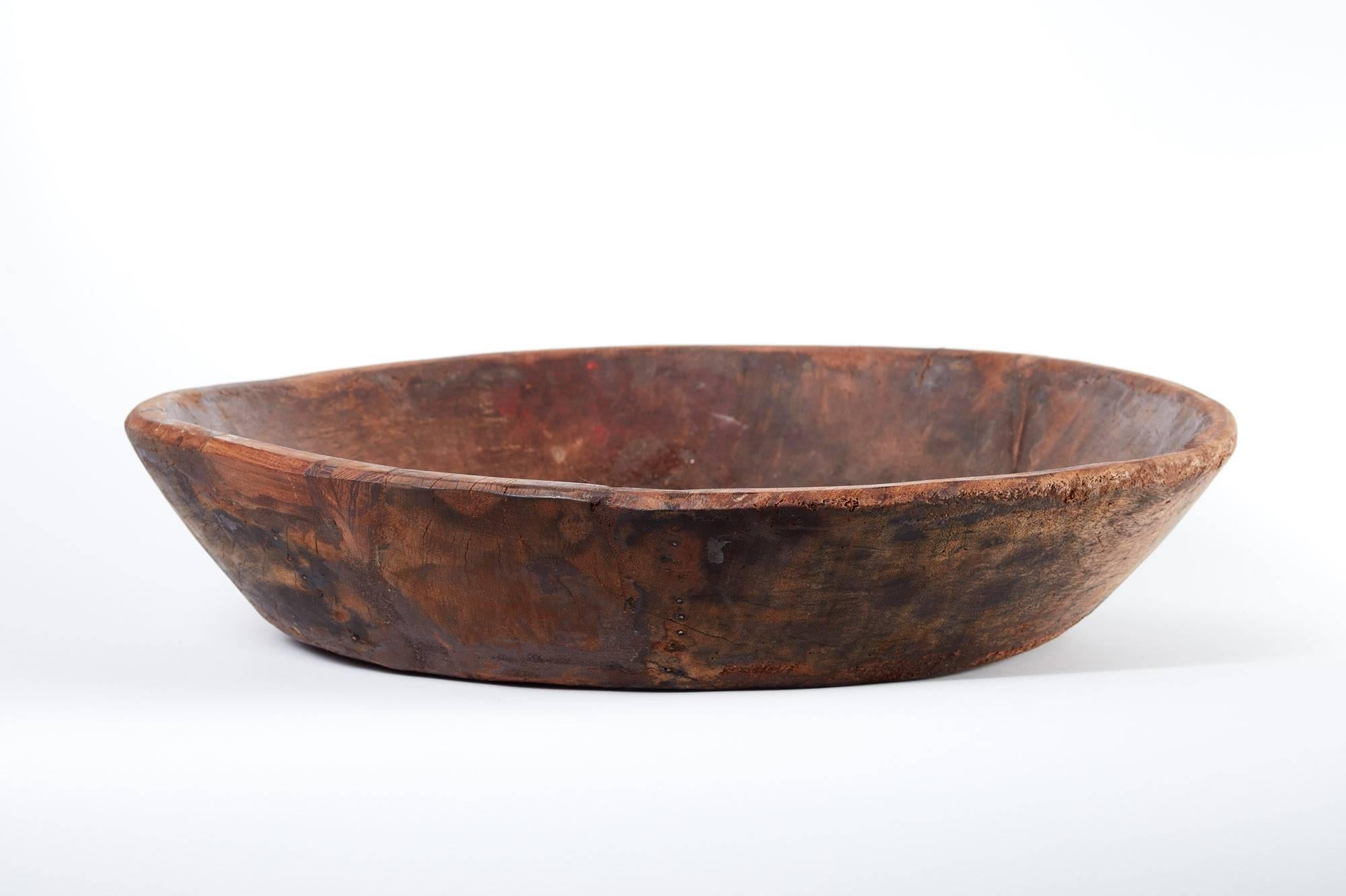 Early 19th century wooden bowl. Handcrafted wood bowl, small nail detail in construction. Rich patina and shallow sides makes this perfect for a centerpiece on a large kitchen island or dining table.