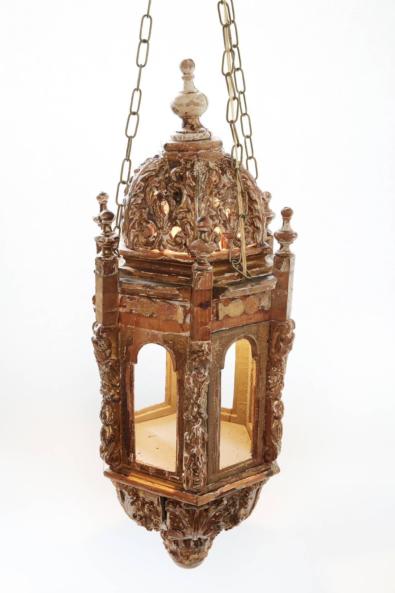 Pair of 18th century Italian Giltwood Lanterns found in England
The details of the lanterns reflects the period of fabrication. The remaining gilt is evident but not prevalent. The pieces were originally candle lit lanterns on posts which were held
