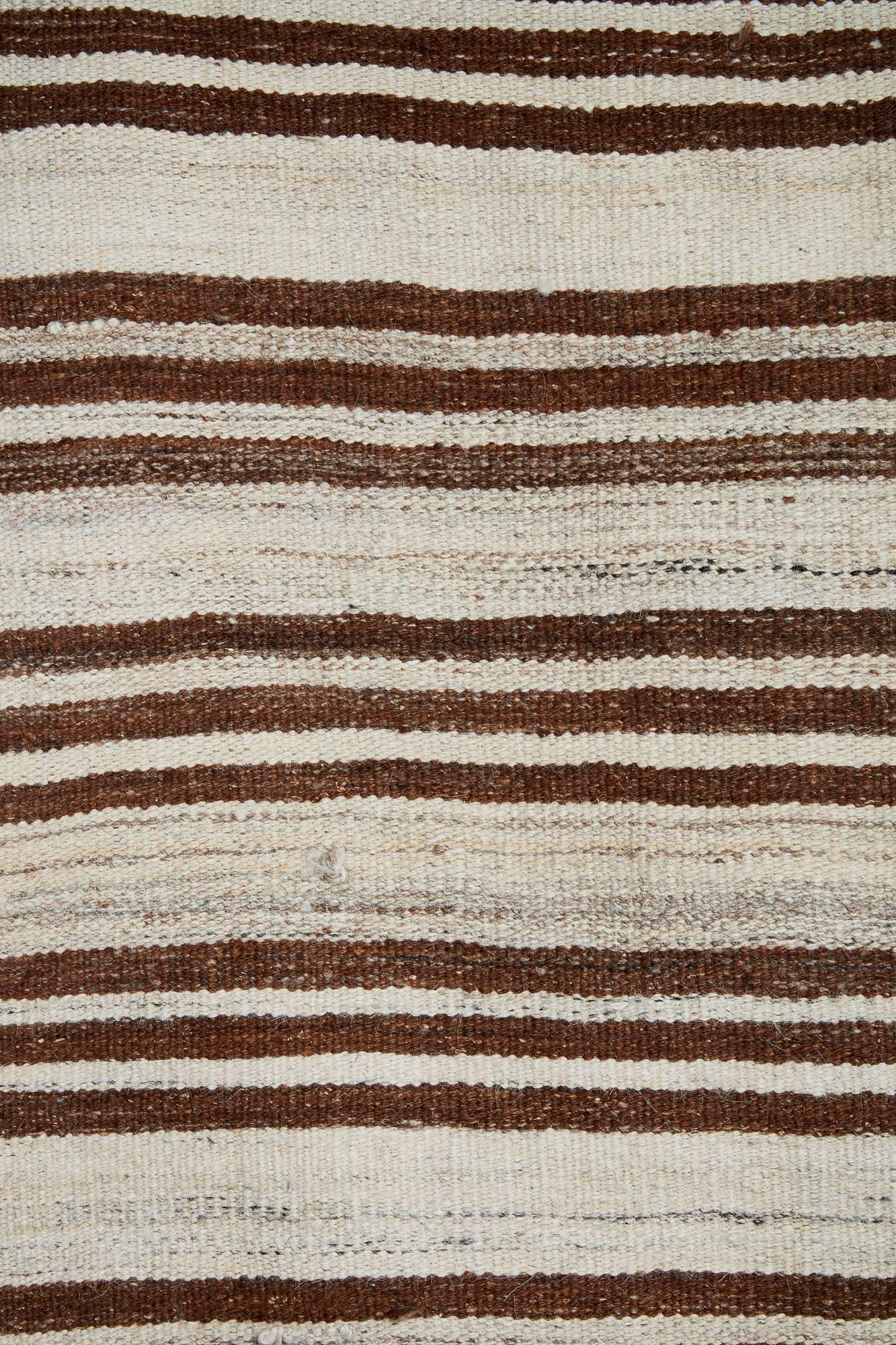 20th century Turkish striped flat-weave Kilim
Shades of crème and brown make up this wonderful Turkish Kilim
Nice size makes this easily useable for interior spaces.
 