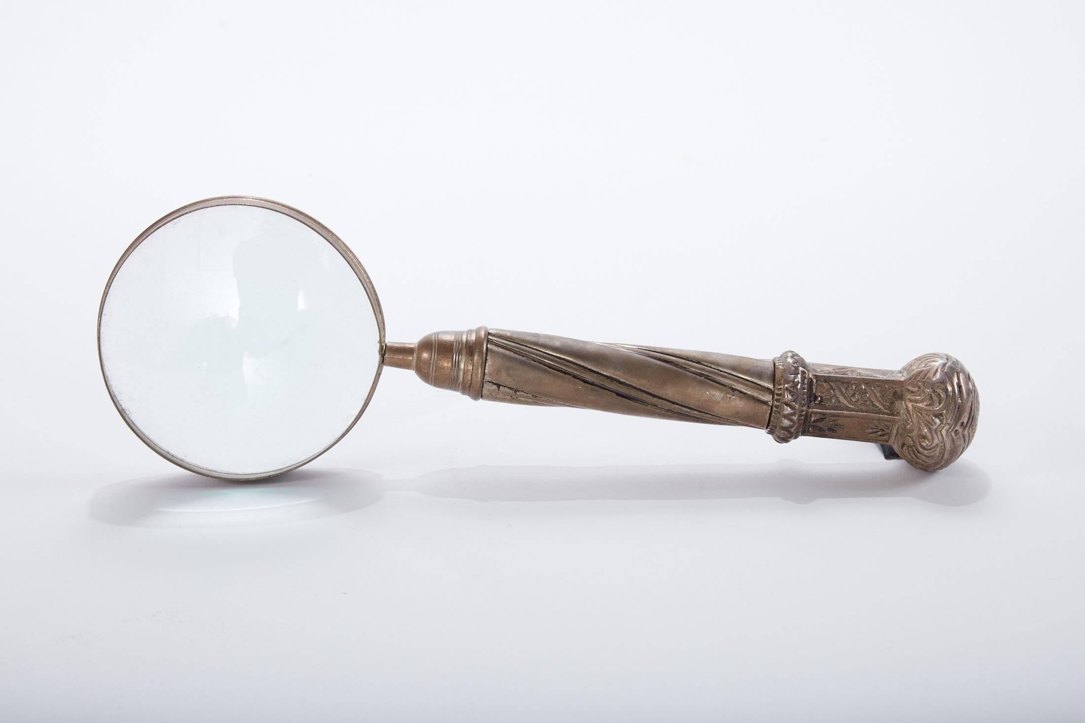 Early 20th century French magnifying glass with ornate pewter handle
Found in the South of France.