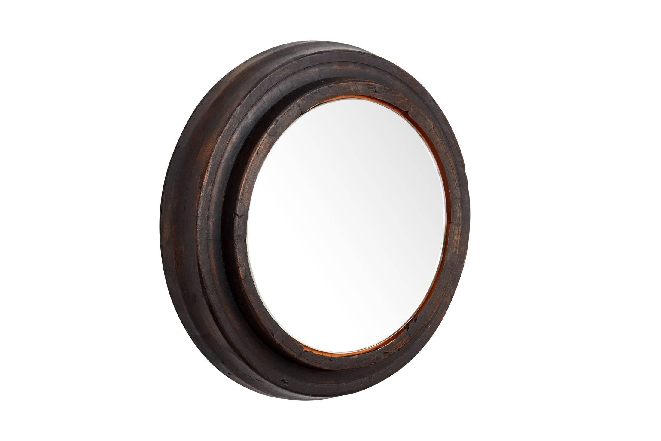 Early 20th century black wooden foundry gear frame (mirrored)
Nice graphic object


Dimensions: Piece is 17 inch diameter and 3.5 inchdeep with actual mirror 11.5 inch in diameter.