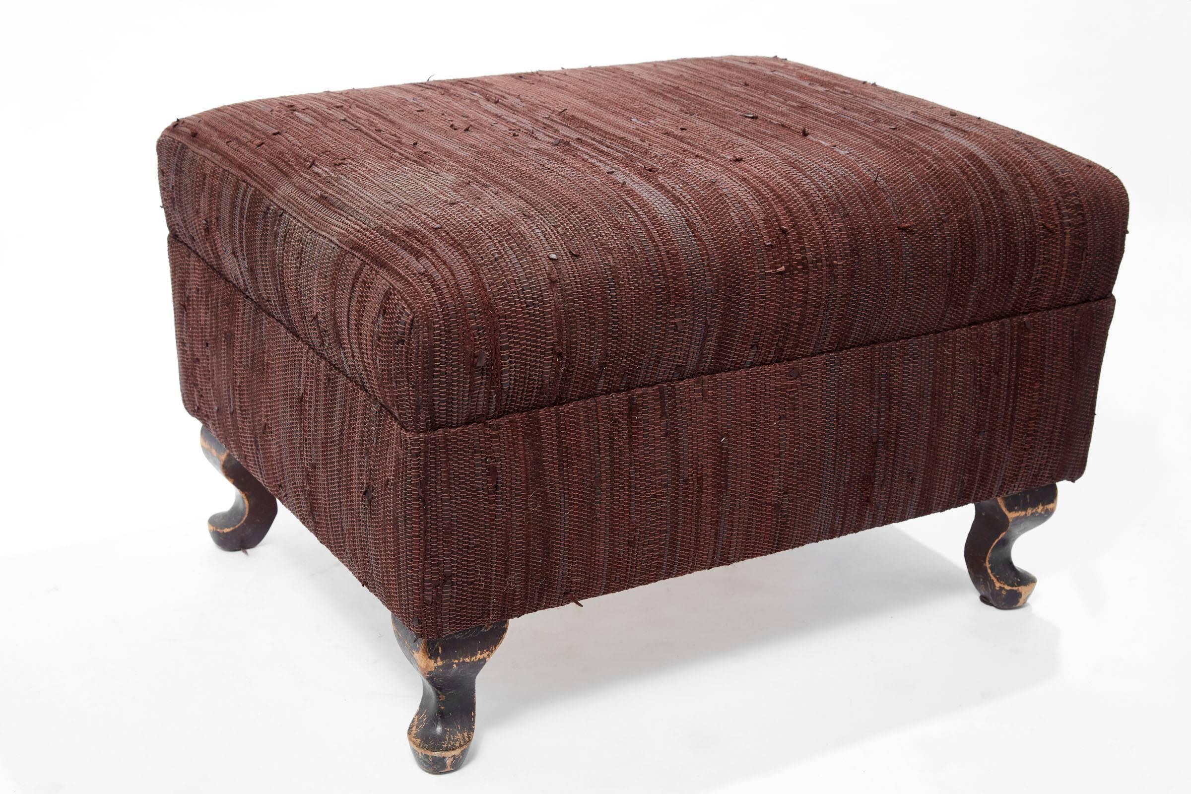 21st century woven leather ottoman on 19th century wooden legs
We used the legs to create a modern version of a footstool using leather woven fabric.