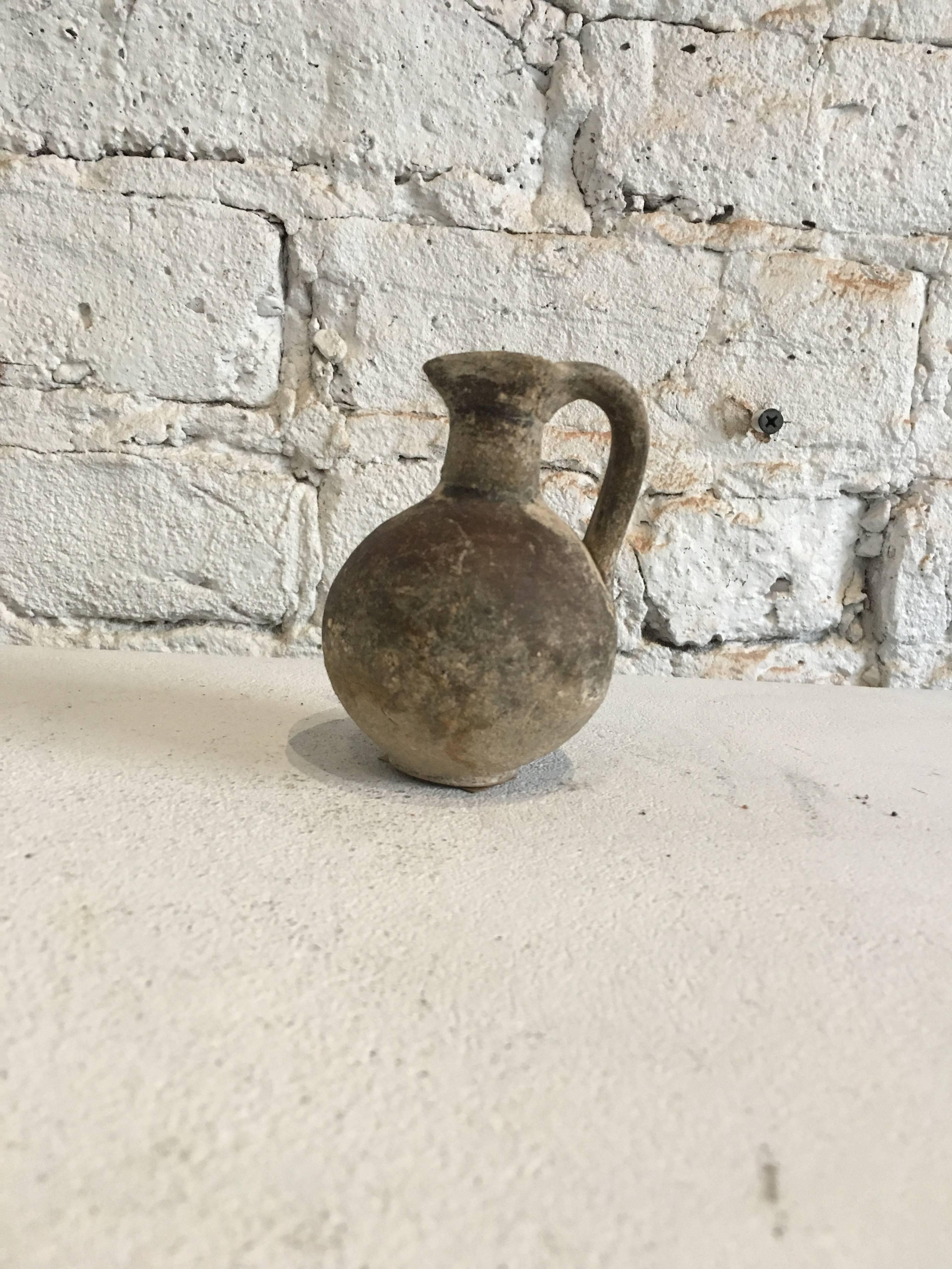 18th century miniature Primitive style roman pitcher 
Beautiful, charming piece of Roman pottery.