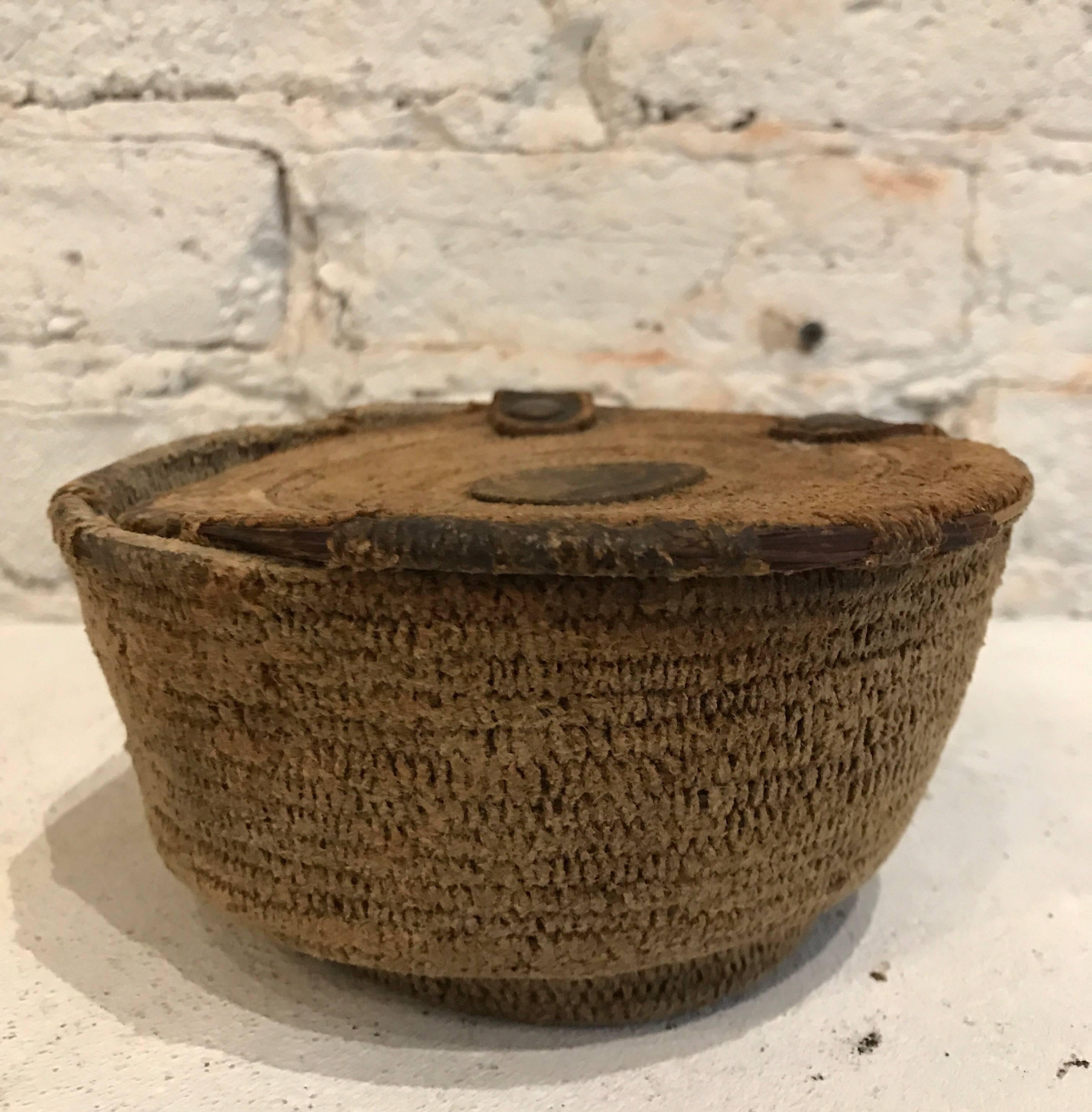 19th century African woven basket food storage container with leather details
Beautiful blonde patina





Measures: Basket: 5.25 inch D x 3 inch H
Base of basket: 3.5 inch D.