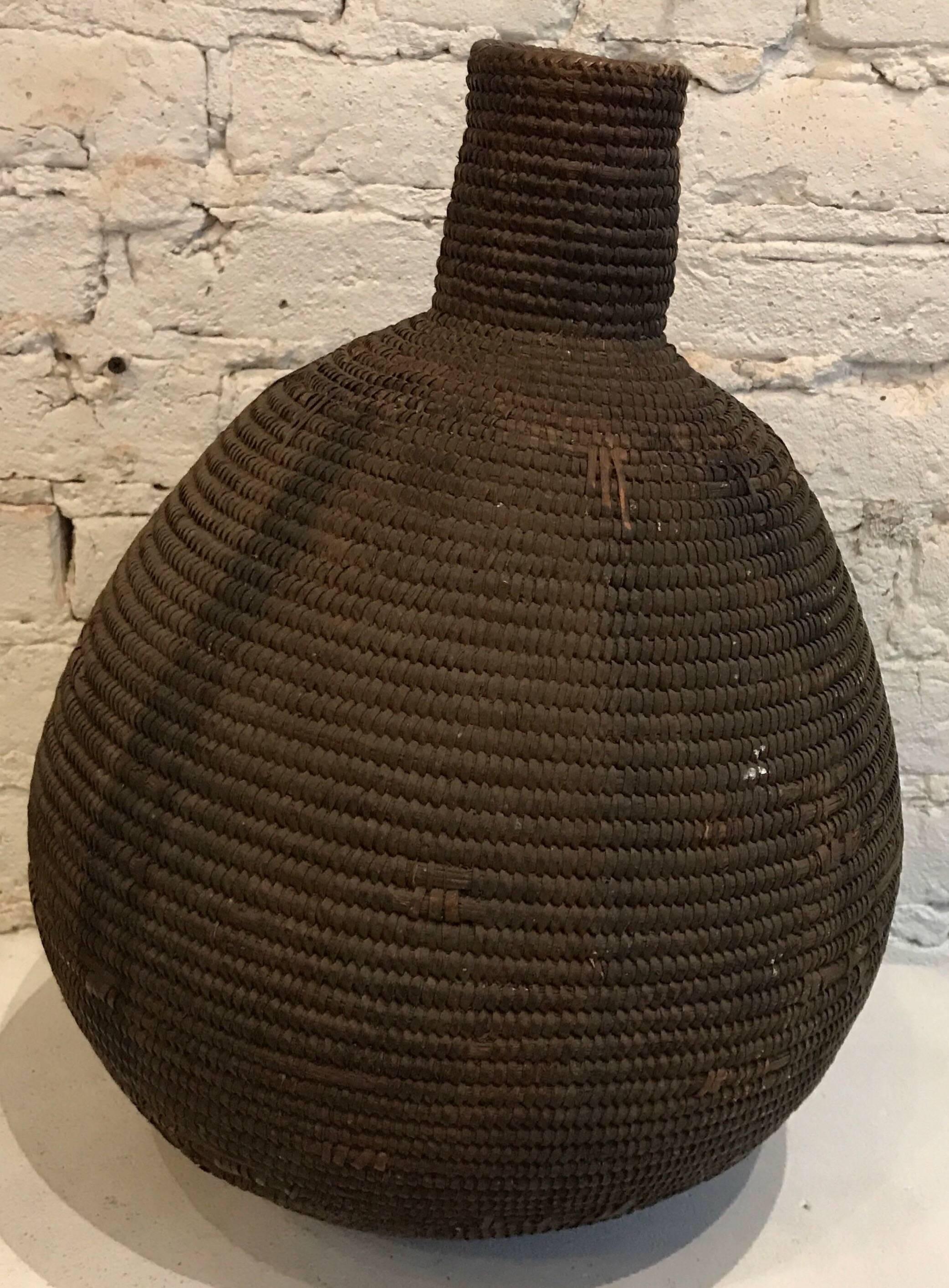 Early 20th Century Woven Straw/Mud Honey Basket




Dimensions: 16.75 in. H x 12.5-12.75 in. Diam. Neck is 3.5 in. H with a 2.75 in. Diam