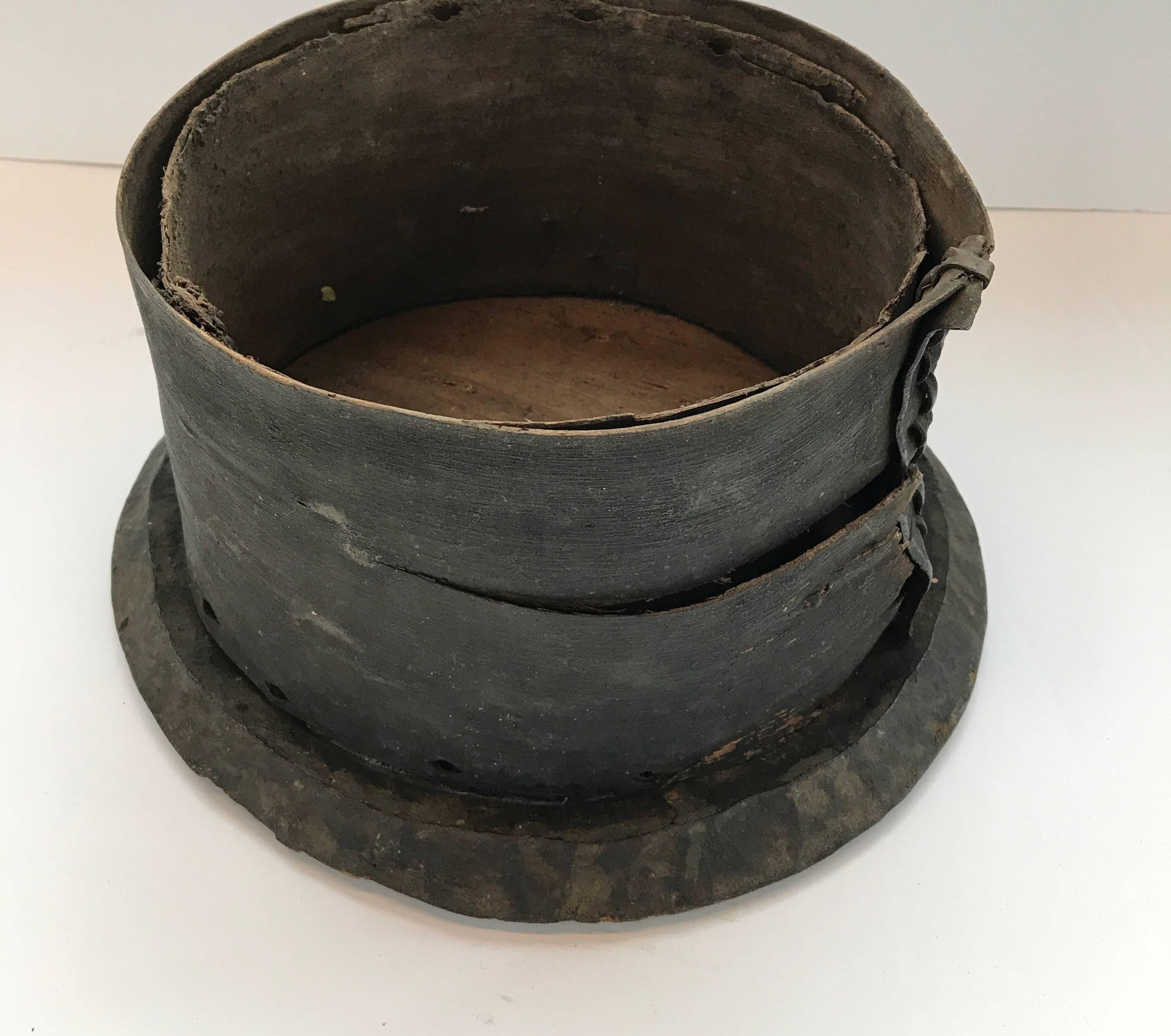 Early 20th century African lidded food storage box
Engraved with Primitive designs



Dimensions:
Box: 8 in. H with a 10-10.25 in. diameter on the top and a 12-13 in. diameter on the bottom. The lid has a 11.5-13 in. diameter.