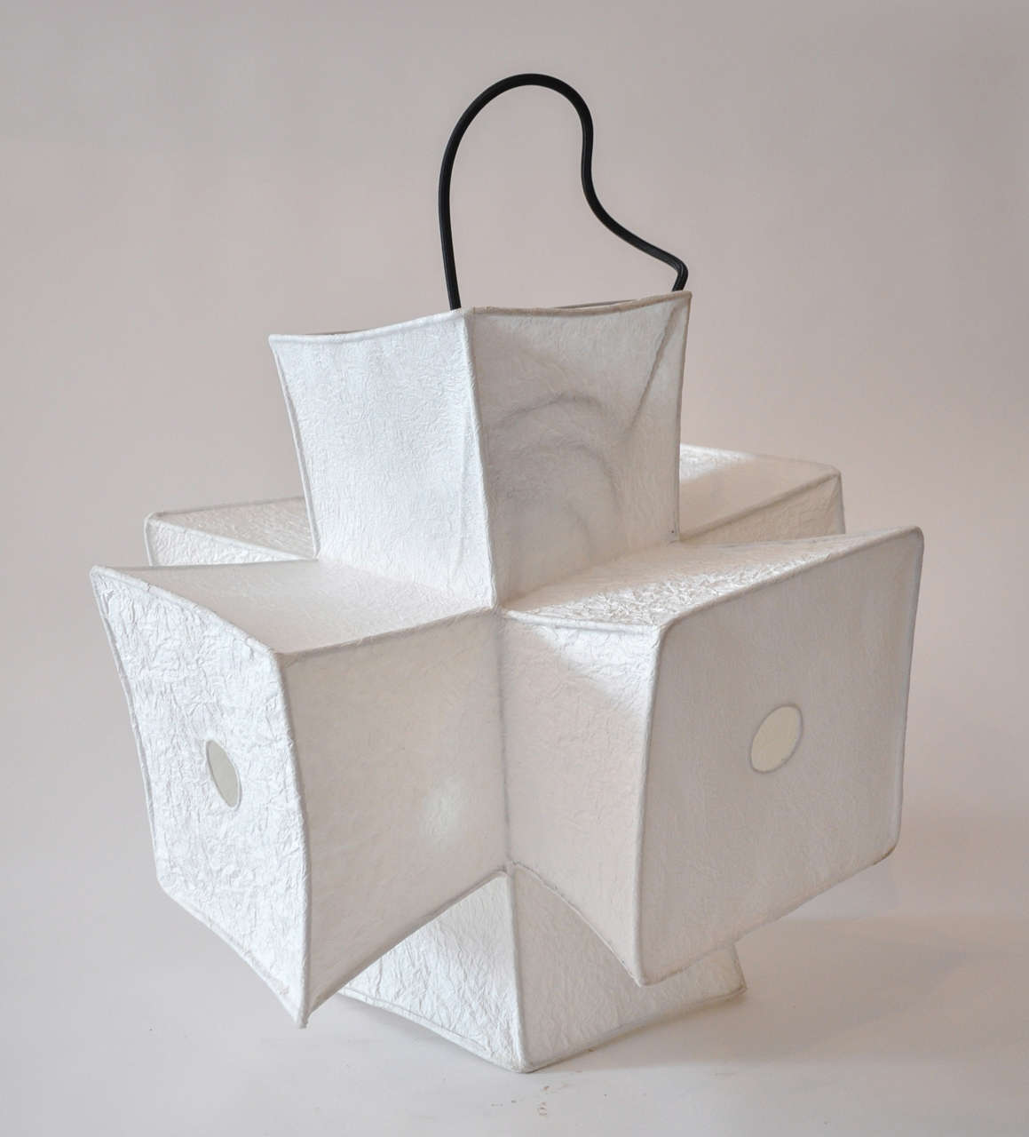 Light fixture and paper lantern by Andrew Stansell, intersect - a Japanese paper and steel armature structural light fixture, lantern. Can be used as a table top, lighted piece or pendent.