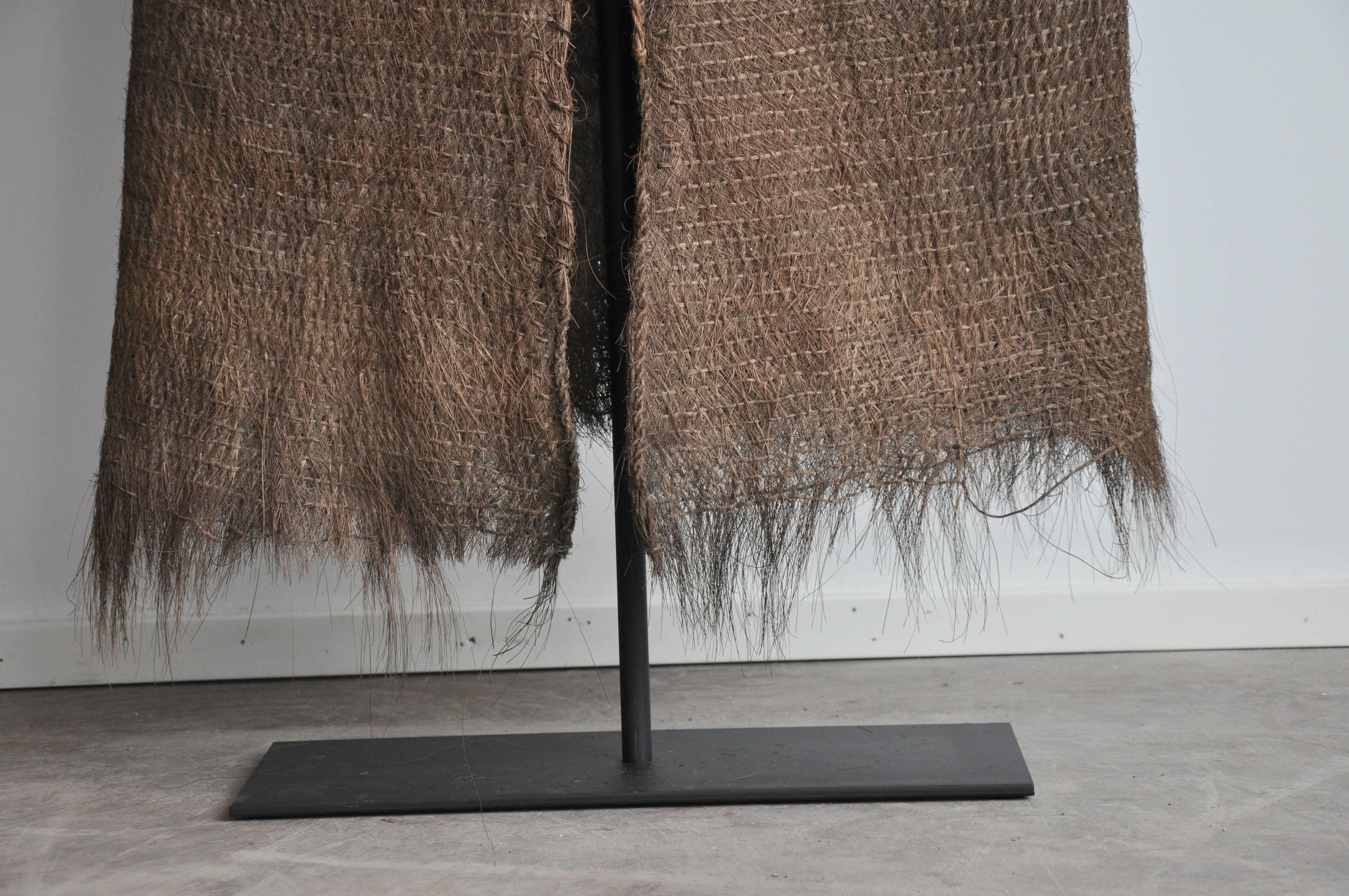 Early 20th Century Coir raincoat from the Chejing province, Southern China.
Woven coconut palm fiber. Traditional farmer's garment, worn in the wet, rainy fields of South China. A true ethnographic object. 

Coir raincoats, circa 1900.
From southern