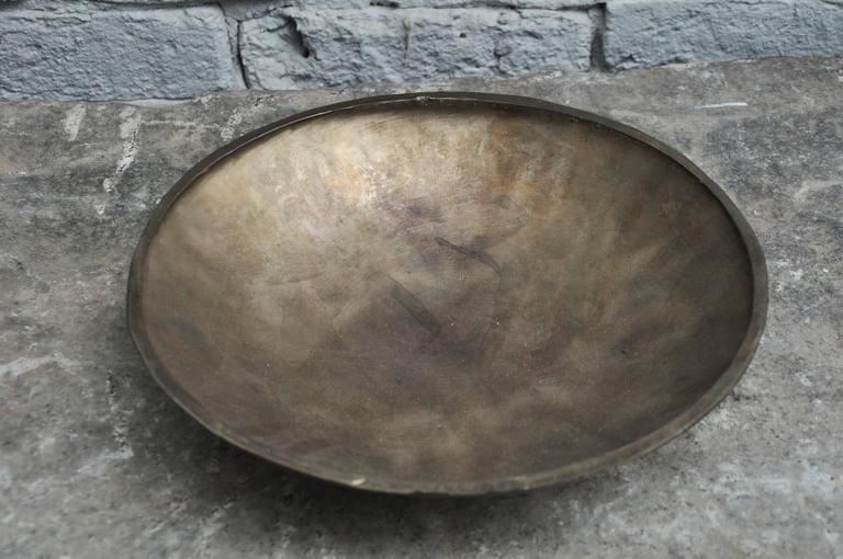 21st Century Bronze bell by musician / artist Elliot Bergman. The bronze bowls have been inspired and cast by Elliot as bells. Inspired by ancient singing bowls from areas in the Himalayan Mountains such as Bhutan and Nepal. Simply put it is