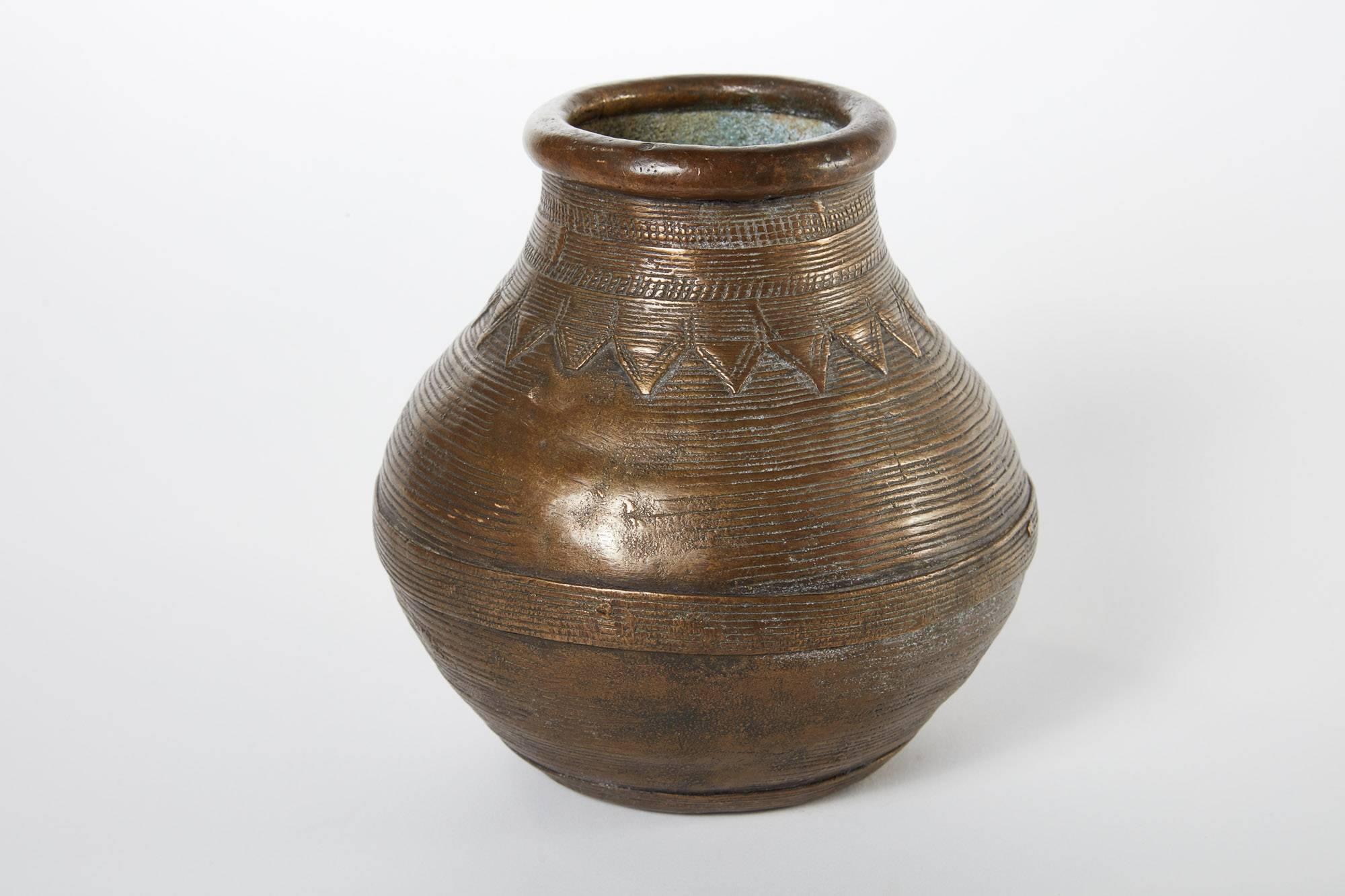 19th Century Bronze Vessel From Nepal 
This detailed piece was found in Nepal and includes a small ring on one side