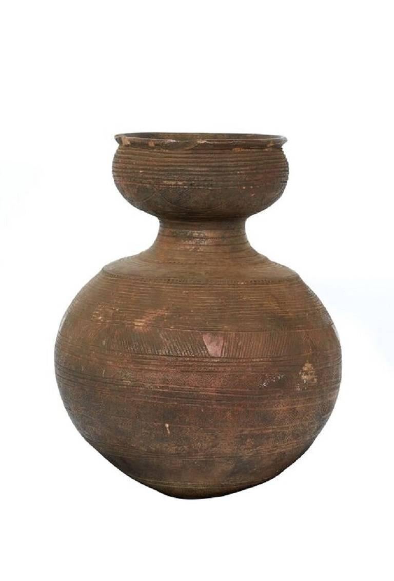 Early 20th century African clay beer pot
Measures: 17" height x 13" diameter.