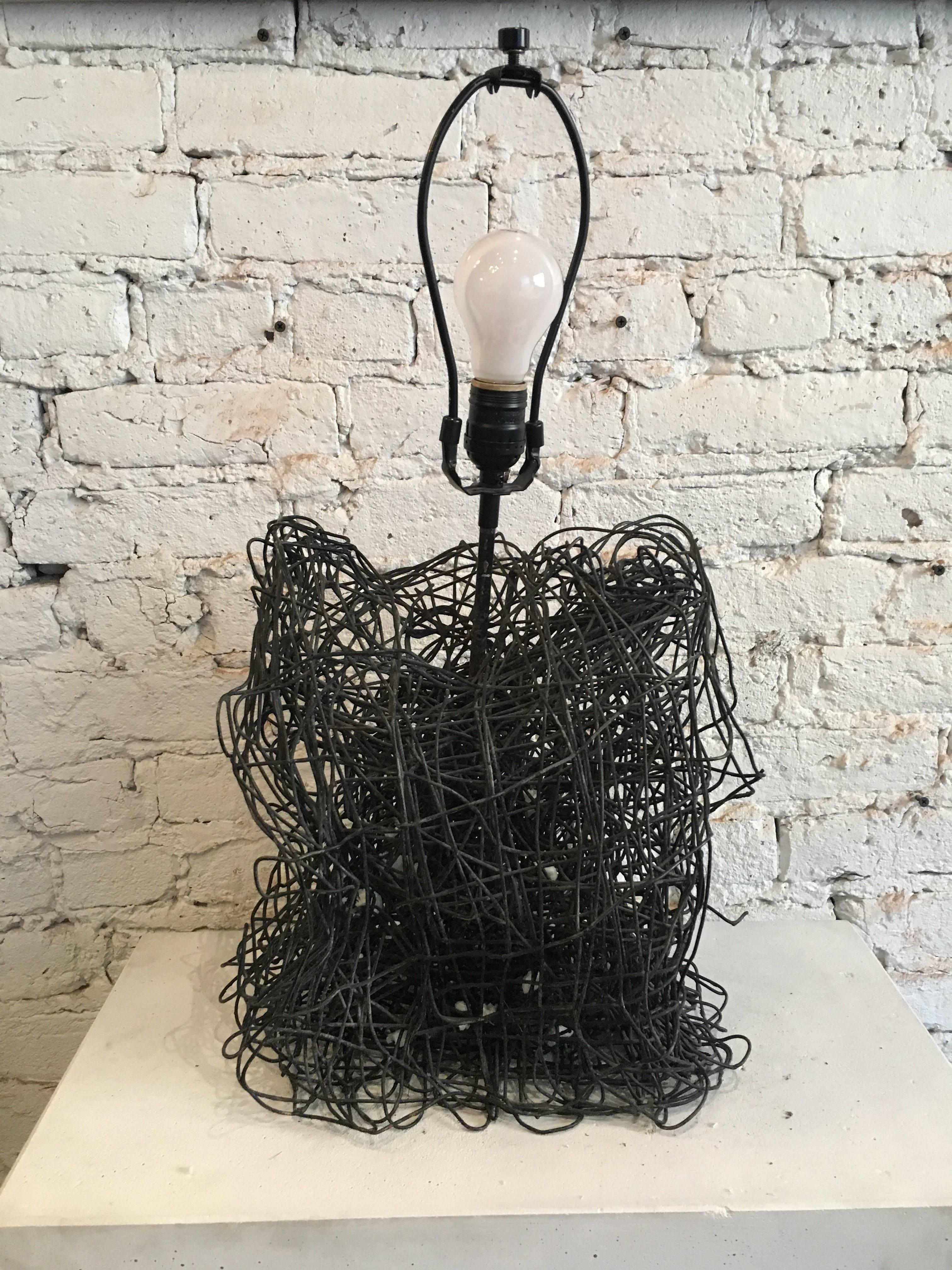 20th century sculptural wire lamp with custom French paper shade
This artisan piece is a one of a kind wire sculpture which has been fabricated into a lamp base. Wired and shaded with a custom French paper shade

Dimensions with shade - 22.5 in H