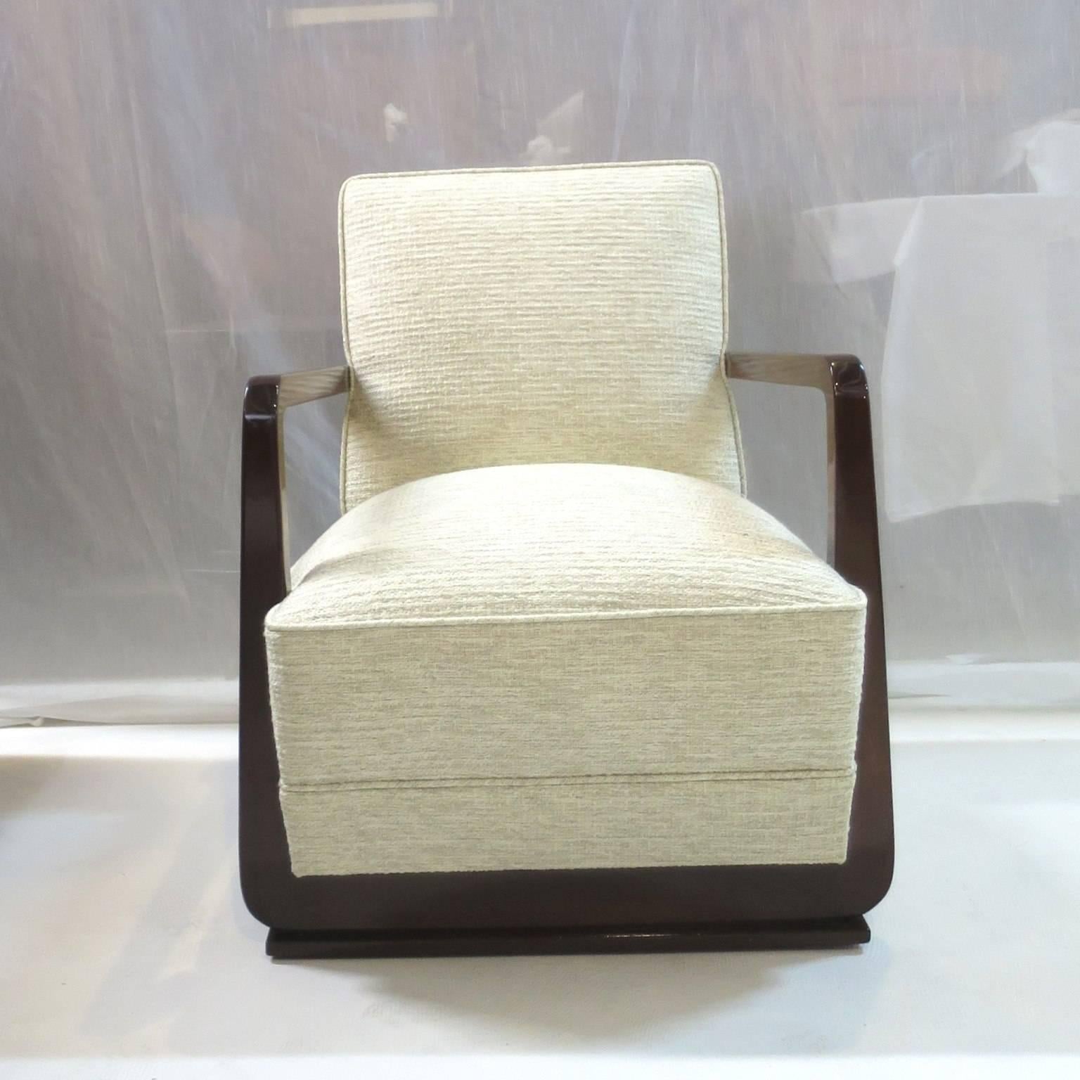 Recently refinished and reupholstered in a light fabric. 
Very cubistic frame shape in solid Mahogany wood. 
Extremely pure lines, great modernist design all around the piece as well as the back. 
Excellent comfort, very elegant armchair.