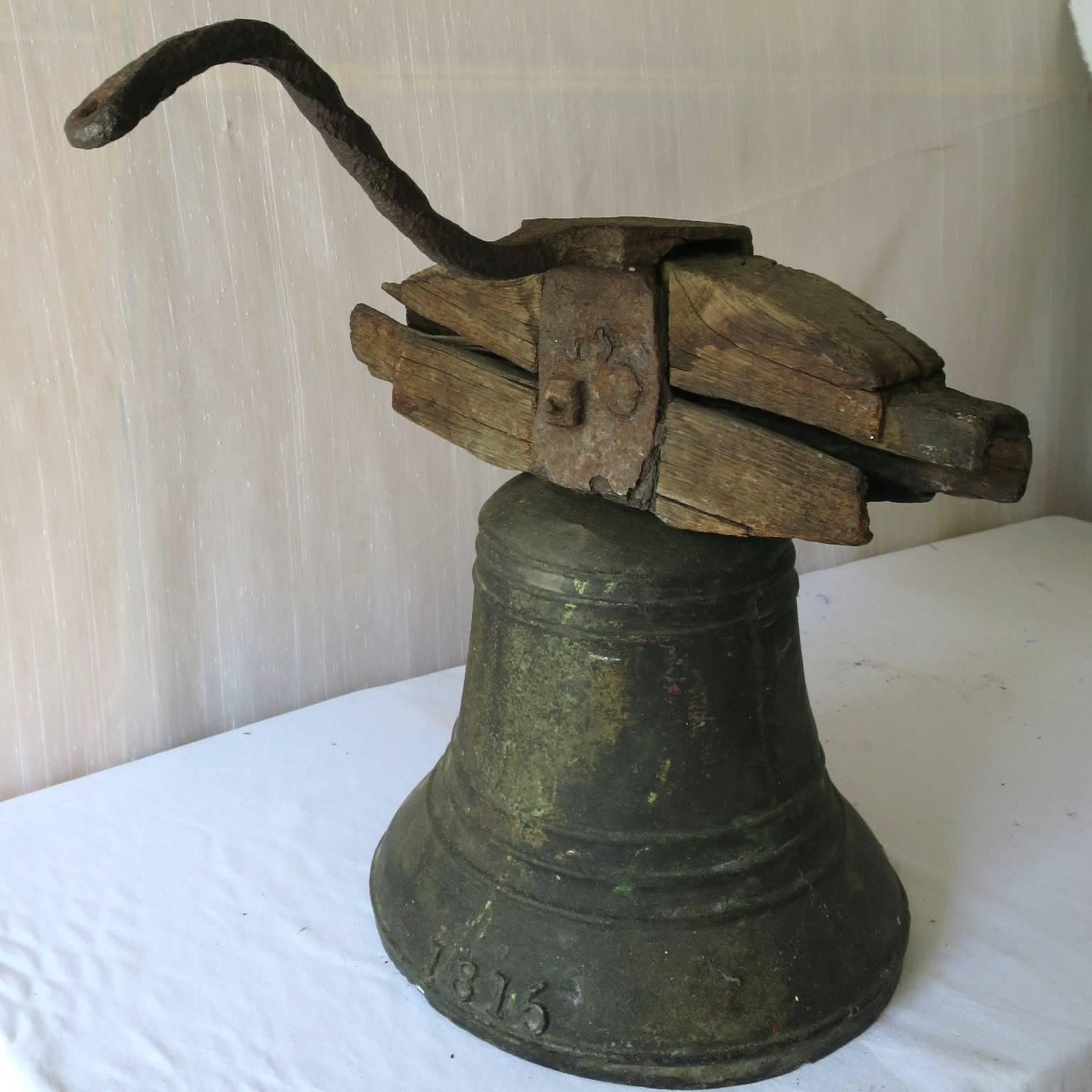 Property Bronze Airin Bell Dated 1815 with its Wrought Iron Top and Wood Beam In Fair Condition For Sale In Miami, FL