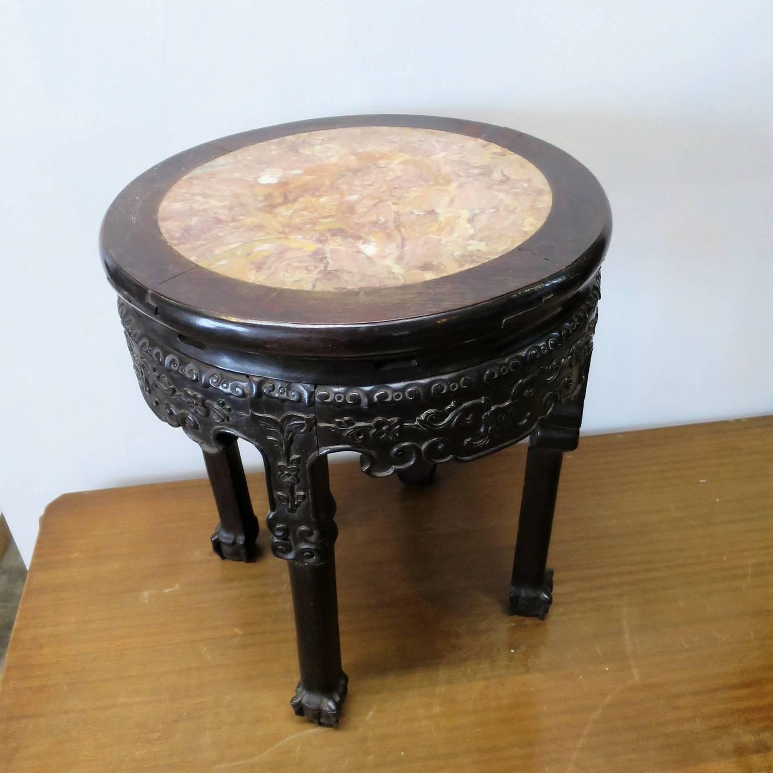 Small Chinese gueridon, or possibly, pedestal carved in tropical wood, marble-top.
         