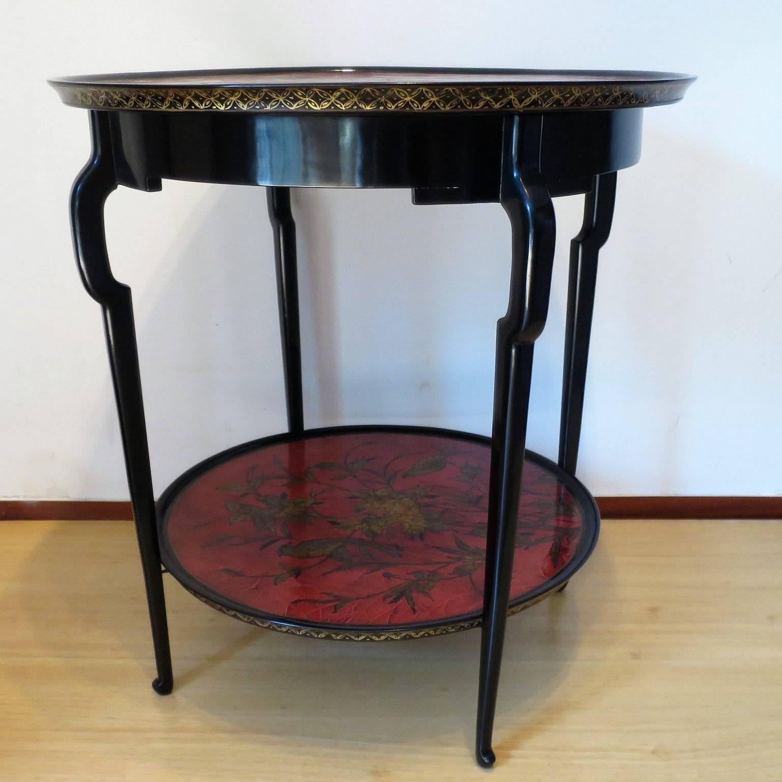 Very Chic Jansen design, the elegant shape of the legs are supporting two red lacquer Tops decorated with birds and flowers.
The structure is in a black lacquer.
Very unique and elegant design.