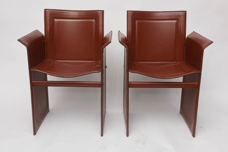 Mid-Century Modern Leather Matteo Grassi pair of armchairs.
Exceptional armchairs in Cognac leather. 
Very comfortable around a dining table .
Another Pair is available .
 