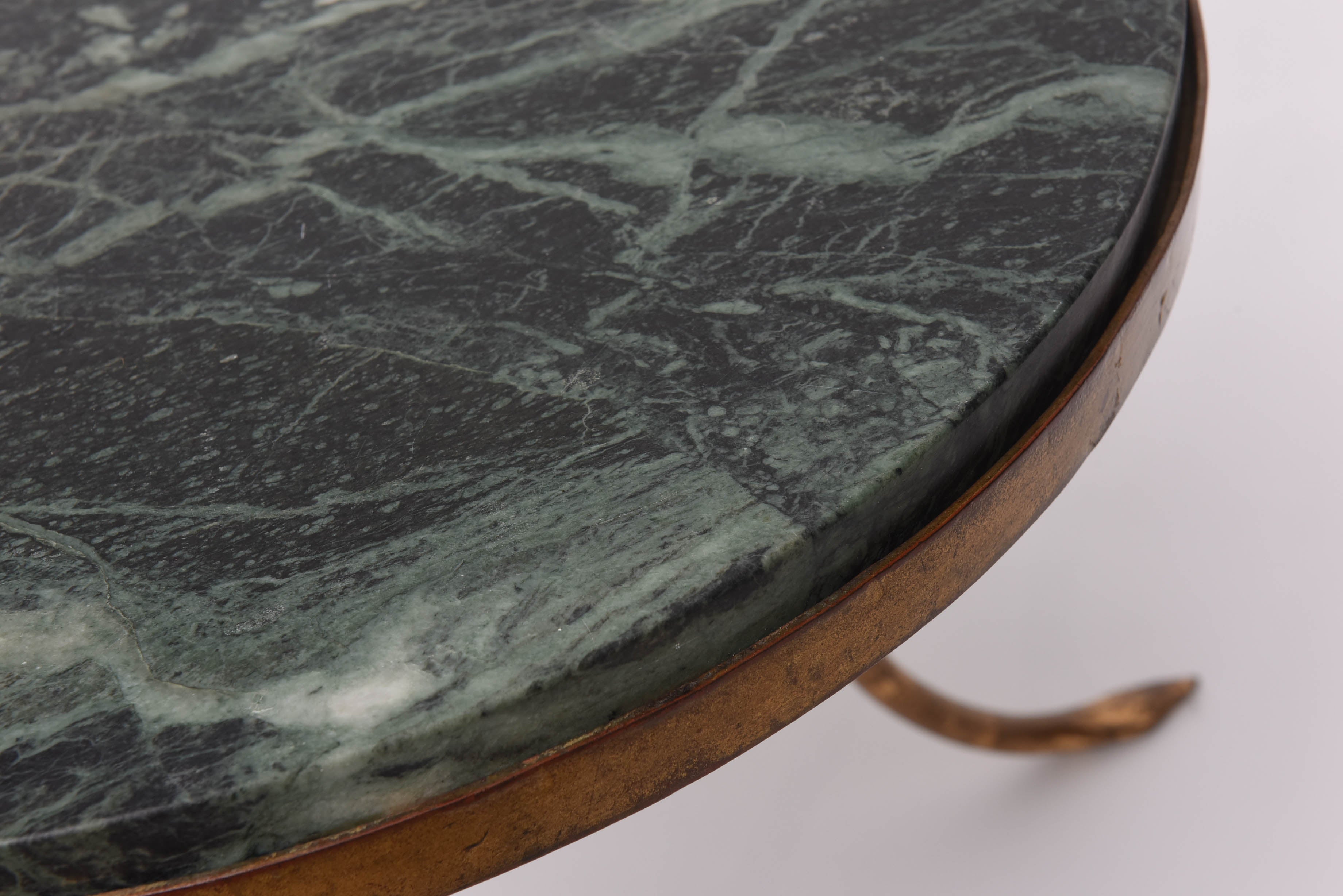 Marble-top on a gilt iron base.
The French designer René Prou style,
circa 1940.
Very elegant design.