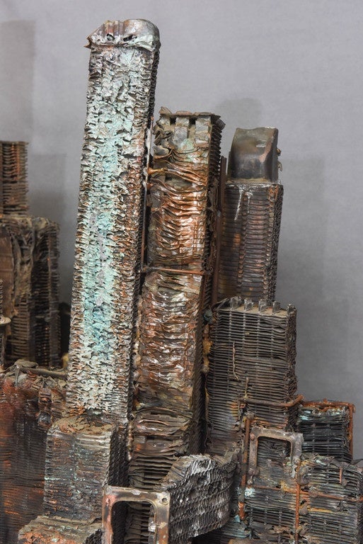 Brutalist art piece. 
Representing sky scrapers, cities and buildings, very unusual, extremely interesting creation.
Unsigned piece, in the style of Antony Bearden.