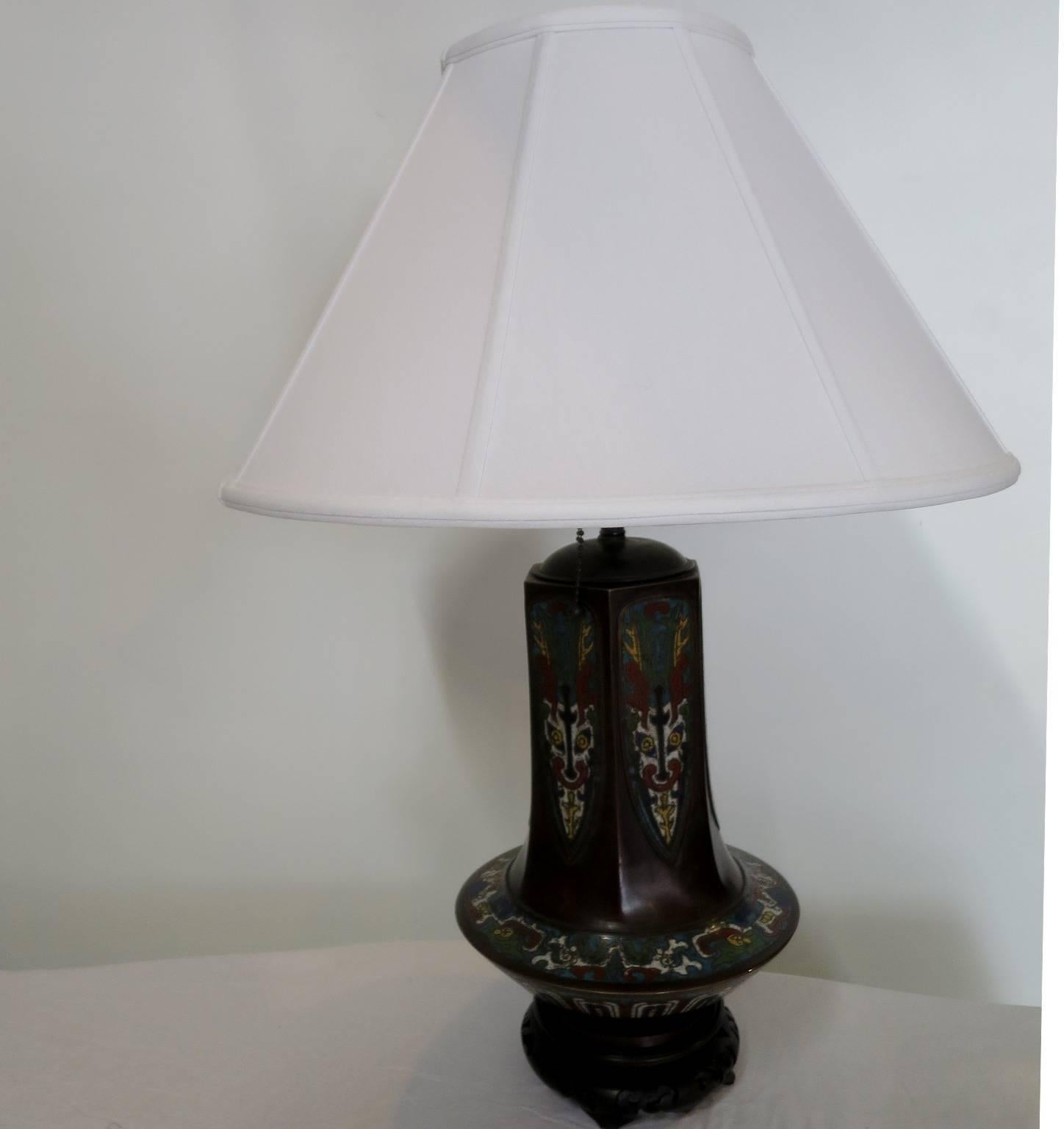The cloisonné enamel bronze vase is mounted in table lamp.
The quality of the piece is very interesting as an object by itself.
The shape is unusual. The dimension of the vase is 13