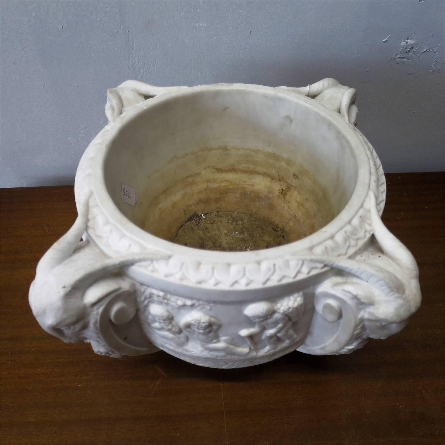 Neoclassical, refined carved piece in solid marble.
Bucolic themes with putti and rams heads.