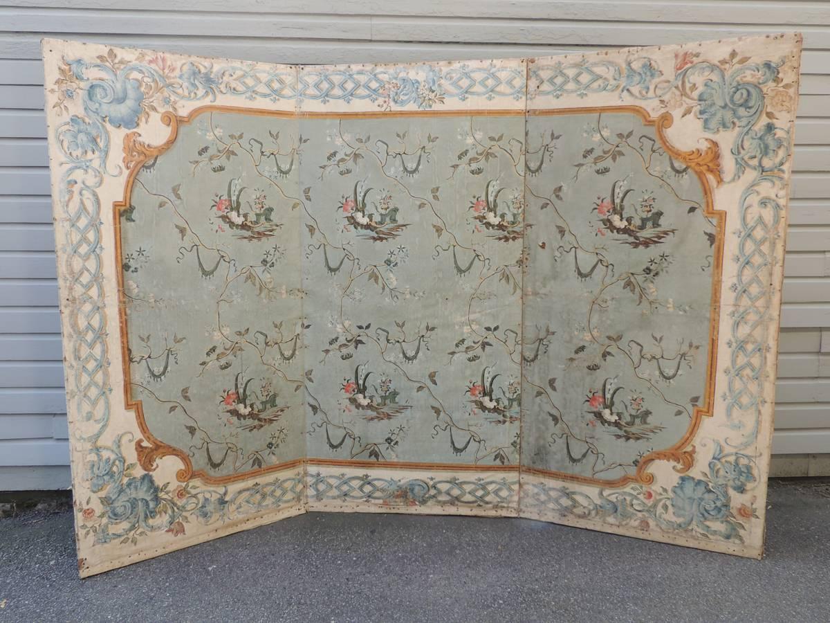A Venetian hand-painted, linen folding screen from the 18th century, circa 1750.  The screen is decorated with classic chinoiserie motifs surrounded by a gold and light-blue colored borders featuring scroll work and acanthus. 

The screen came