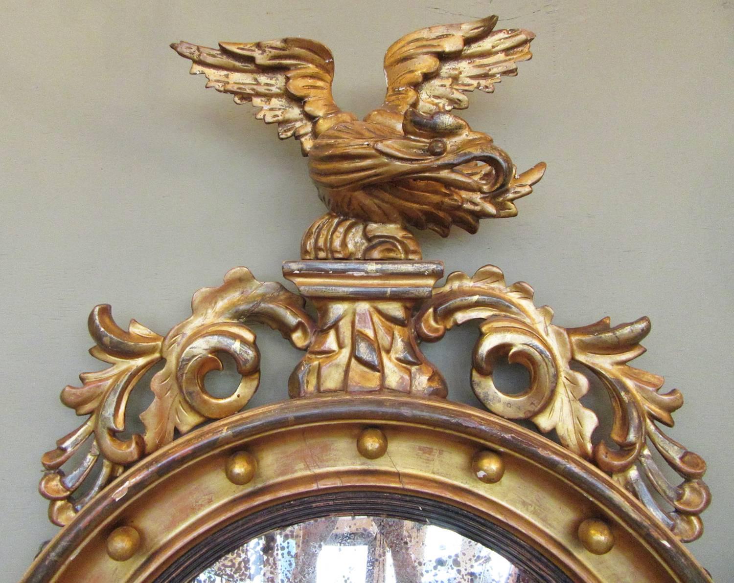 Carved 19th Century English Regency Giltwood Convex Mirror with Eagle and Acanthus
