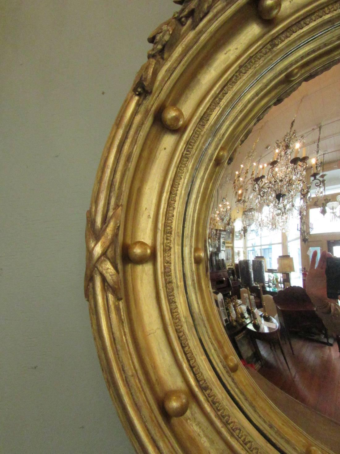 Early 19th Century English Regency Giltwood Convex Mirror with Eagle and Tassle In Excellent Condition In Charleston, SC