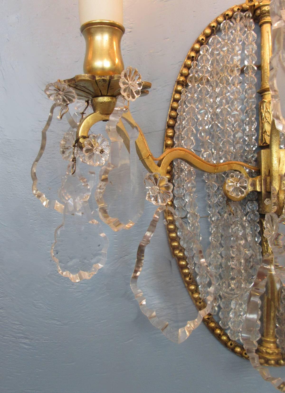 Gilt Pair of Early 19th Century Italian Neoclassical Crystal Medallion Back Sconces For Sale