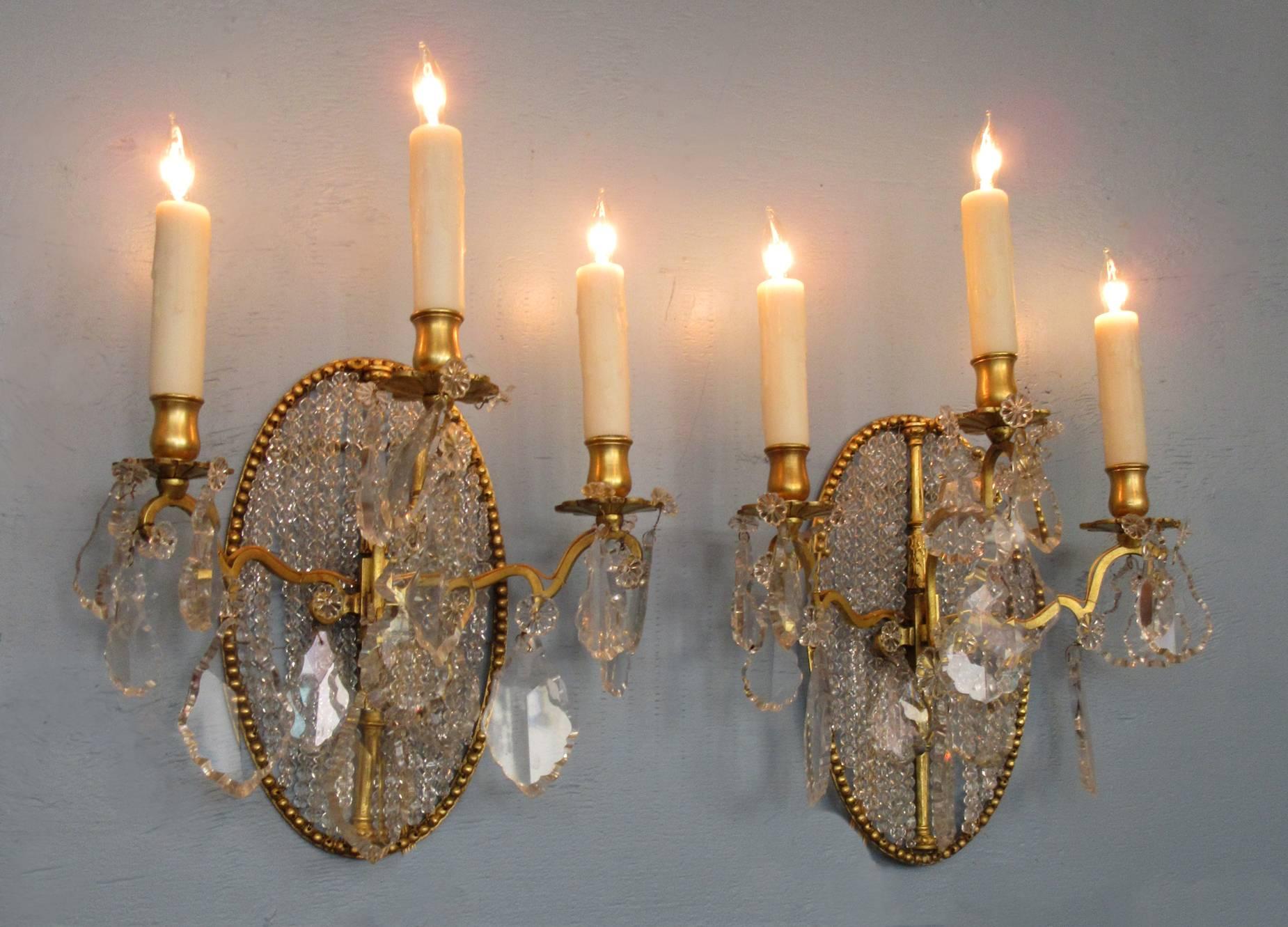 Bronze Pair of Early 19th Century Italian Neoclassical Crystal Medallion Back Sconces For Sale