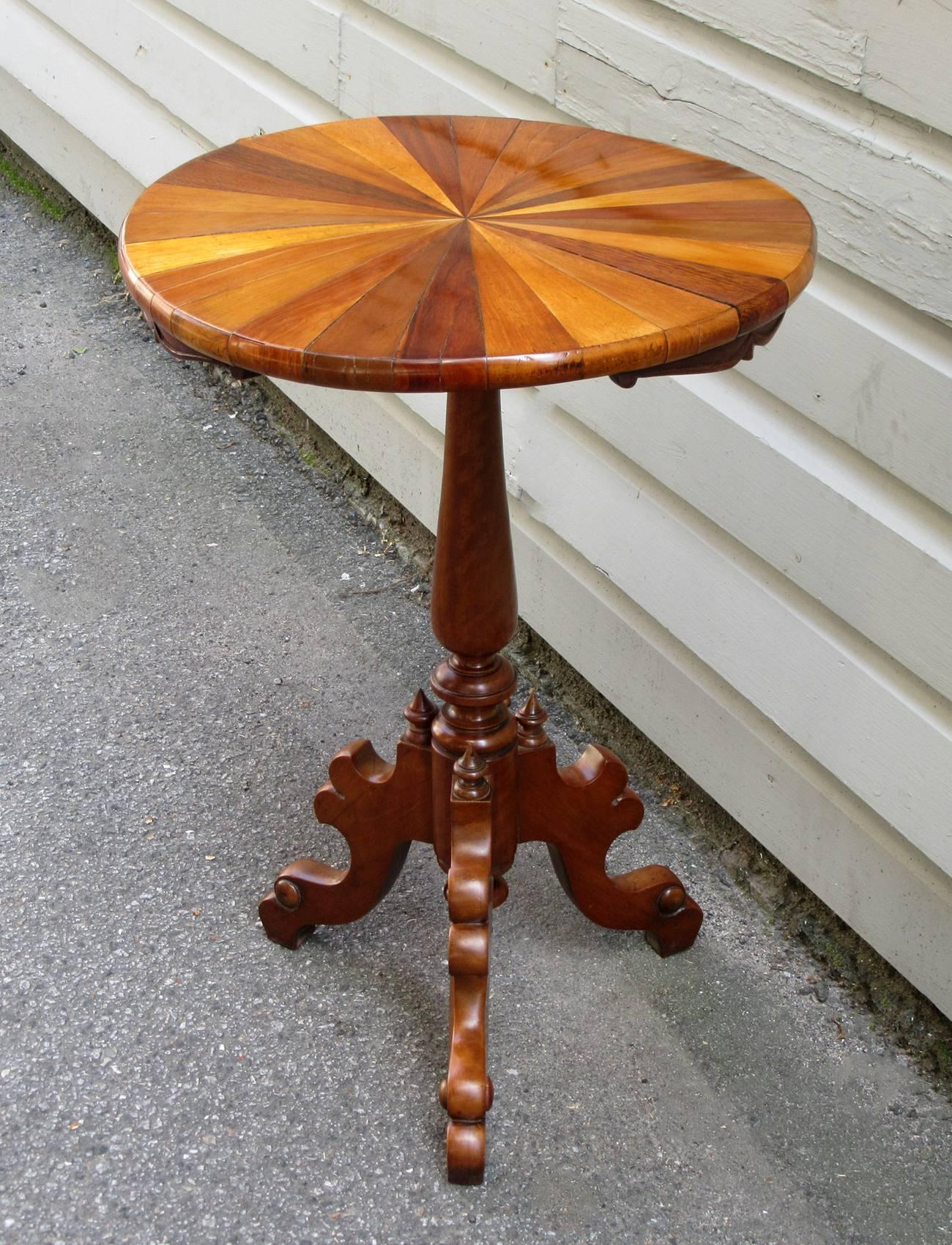 An intriguing cedrela and rosewood tripod pedestal table from Tobago, circa 1885, featuring a specimen top with labeled exotic woods. The handwritten labels underneath catalog each of the wood specimens used in its making and a second exhibitor's