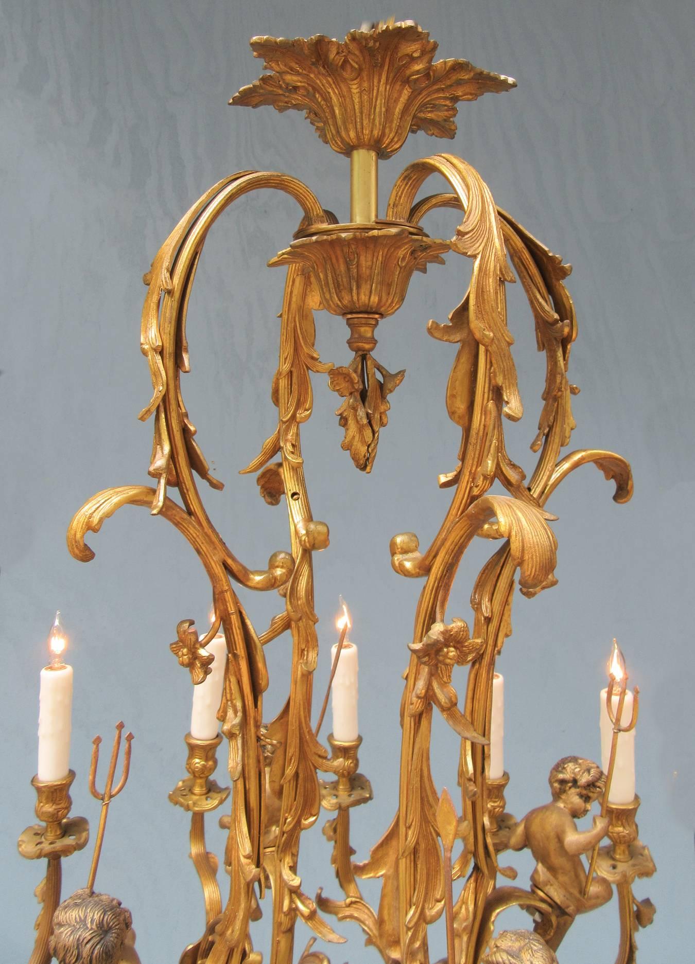 Gilt Early 20th Century French Louis XIV Bronze Doré Foliate and Putti Chandelier