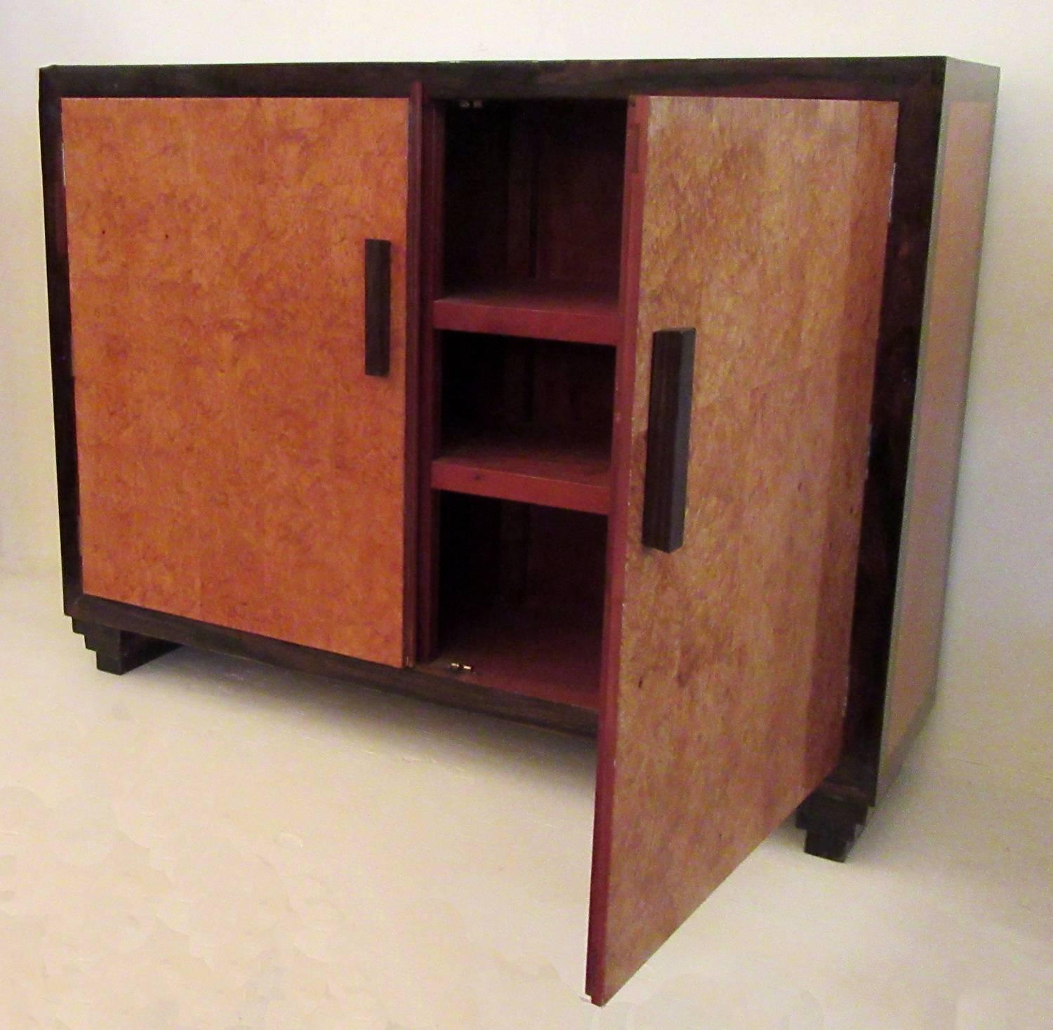 An Art Deco style exotic wood cabinet, circa 1940, from Georgetown, British Guyana. Many fine furniture was crafted there due to the access of South American exotic hardwoods. This cabinet is featured in a book by author Michael Connors detailing