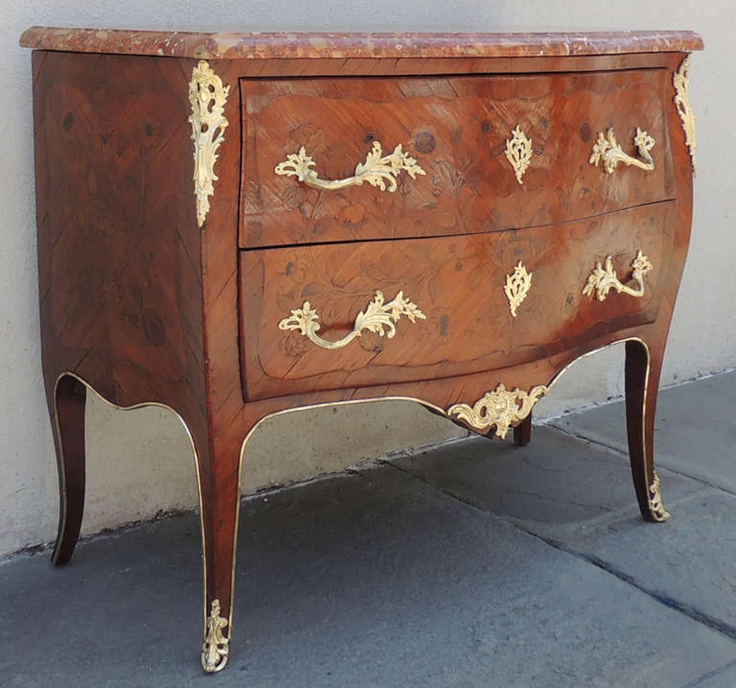 A 19th century Louis XV style Spanish chest, circa 1850, featuring floral marquetry, ormolu and a rouge marble top.